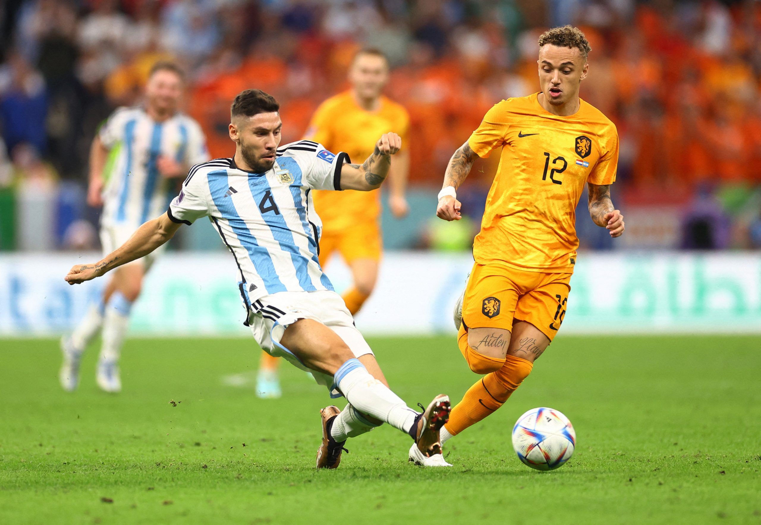 Soccer Football - FIFA World Cup Qatar 2022 - Quarter Final - Netherlands v Argentina - Lusail Stadium, Lusail, Qatar - December 10, 2022   Argentina's Gonzalo Montiel  in action with  Netherlands' Noa Lang REUTERS/Carl Recine