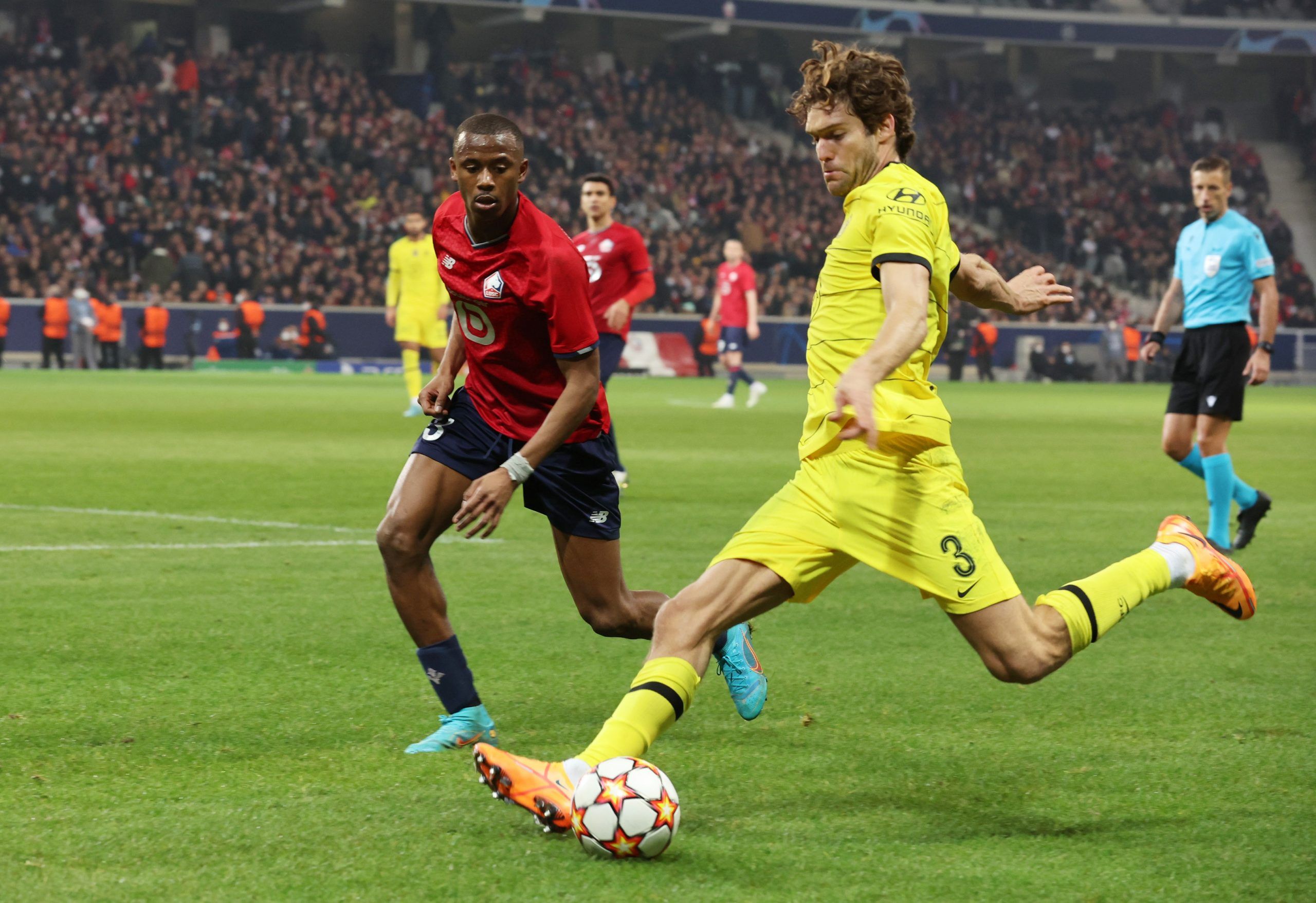 Soccer Football - Champions League - Lille v Chelsea - Stade Pierre-Mauroy, Villeneuve-d'Ascq, France - March 16, 2022 Chelsea's Marcos Alonso in action with Lille's Tiago Djalo REUTERS/Pascal Rossignol