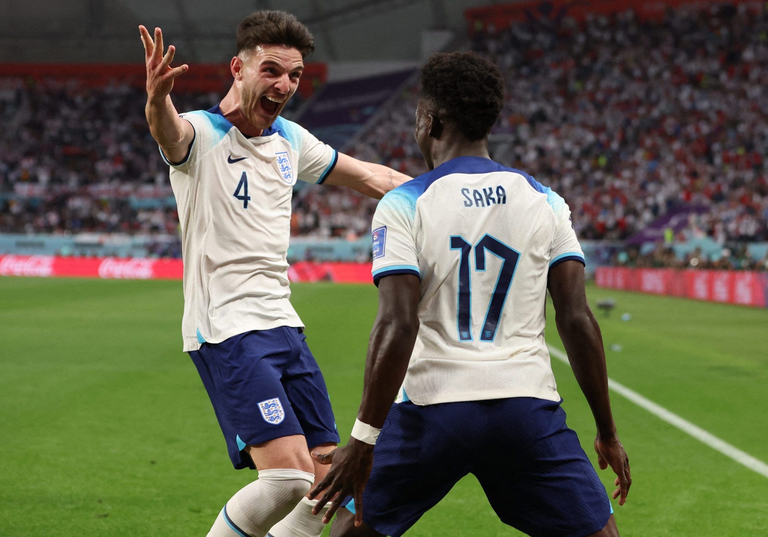 England's Bukayo Saka celebrates scoring their second goal with Declan Rice