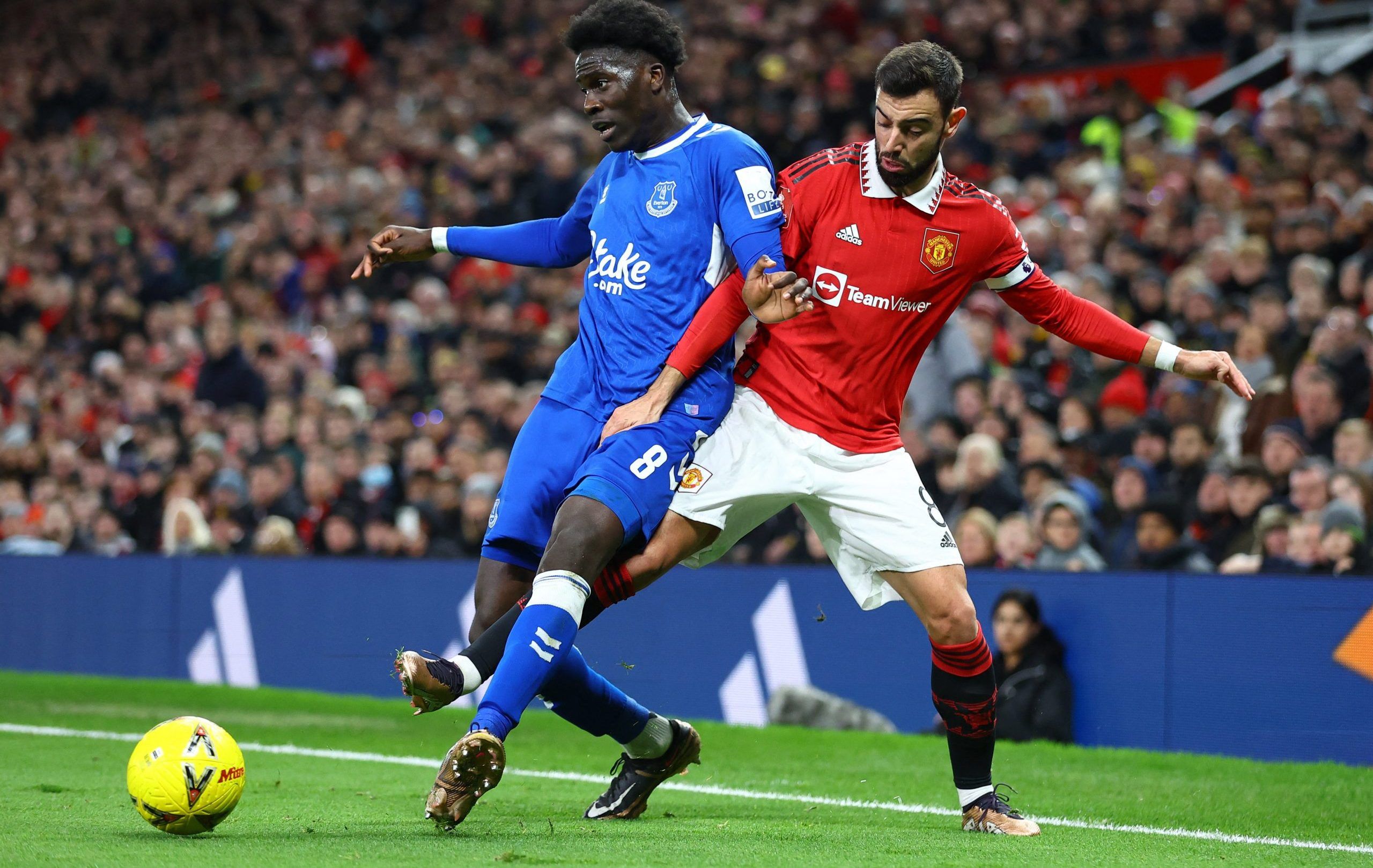 Soccer Football - FA Cup Third Round - Manchester United v Everton - Old Trafford, Manchester, Britain - January 6, 2023 Everton's Amadou Onana in action with Manchester United's Bruno Fernandes REUTERS/Carl Recine
