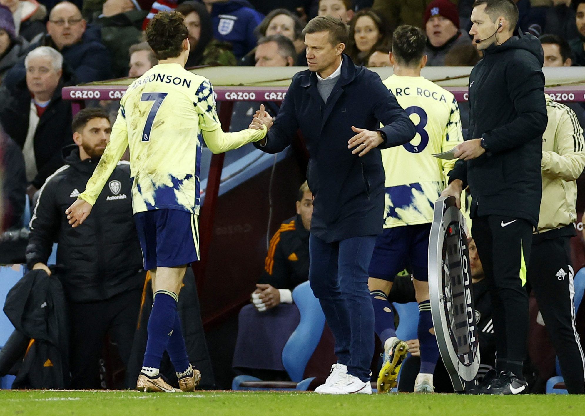 Leeds United's Brenden Aaronson shakes hands with manager Jesse Marsch after being substituted