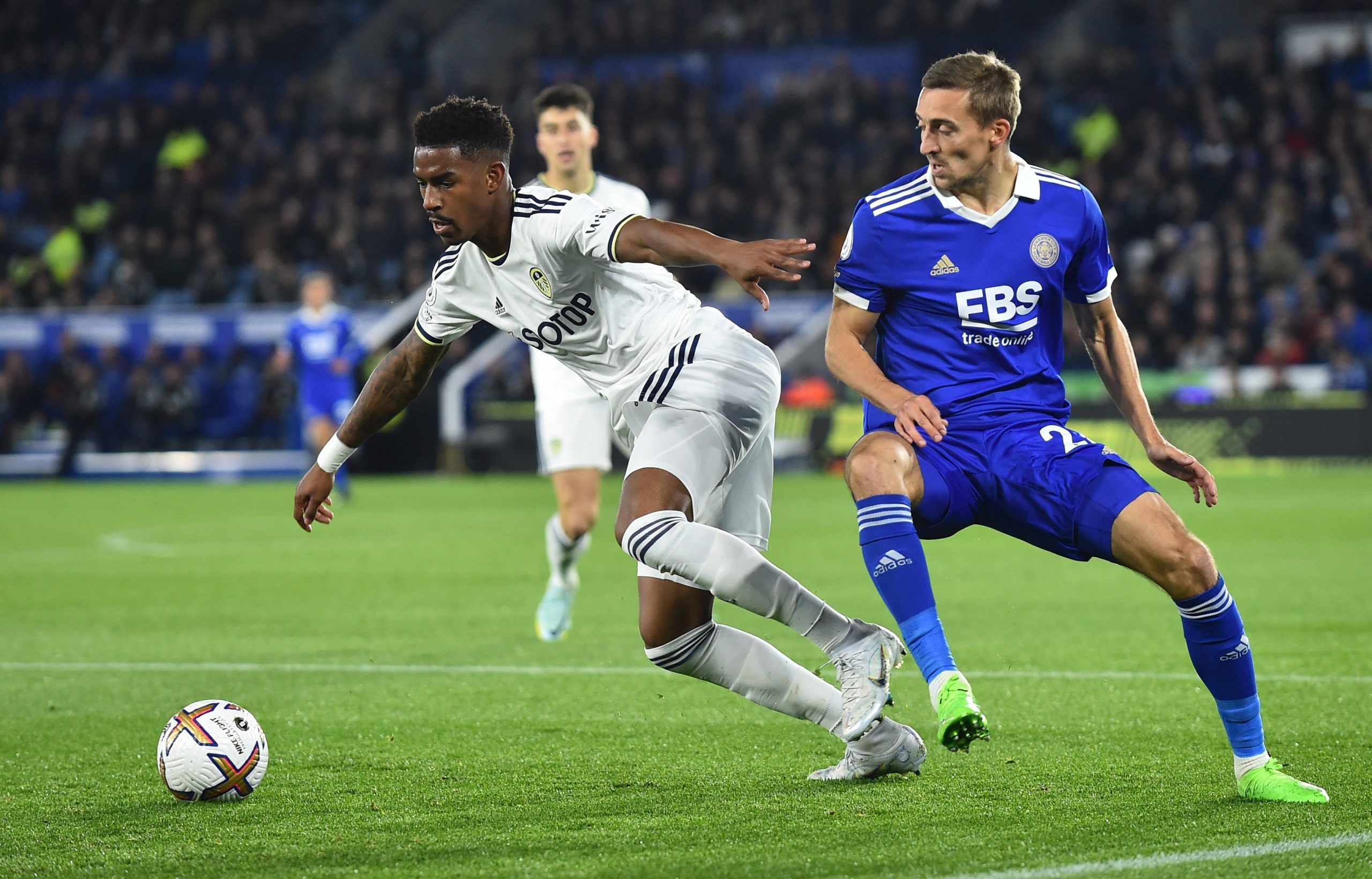 Leeds United's Junior Firpo in action with Leicester City's Timothy Castagne