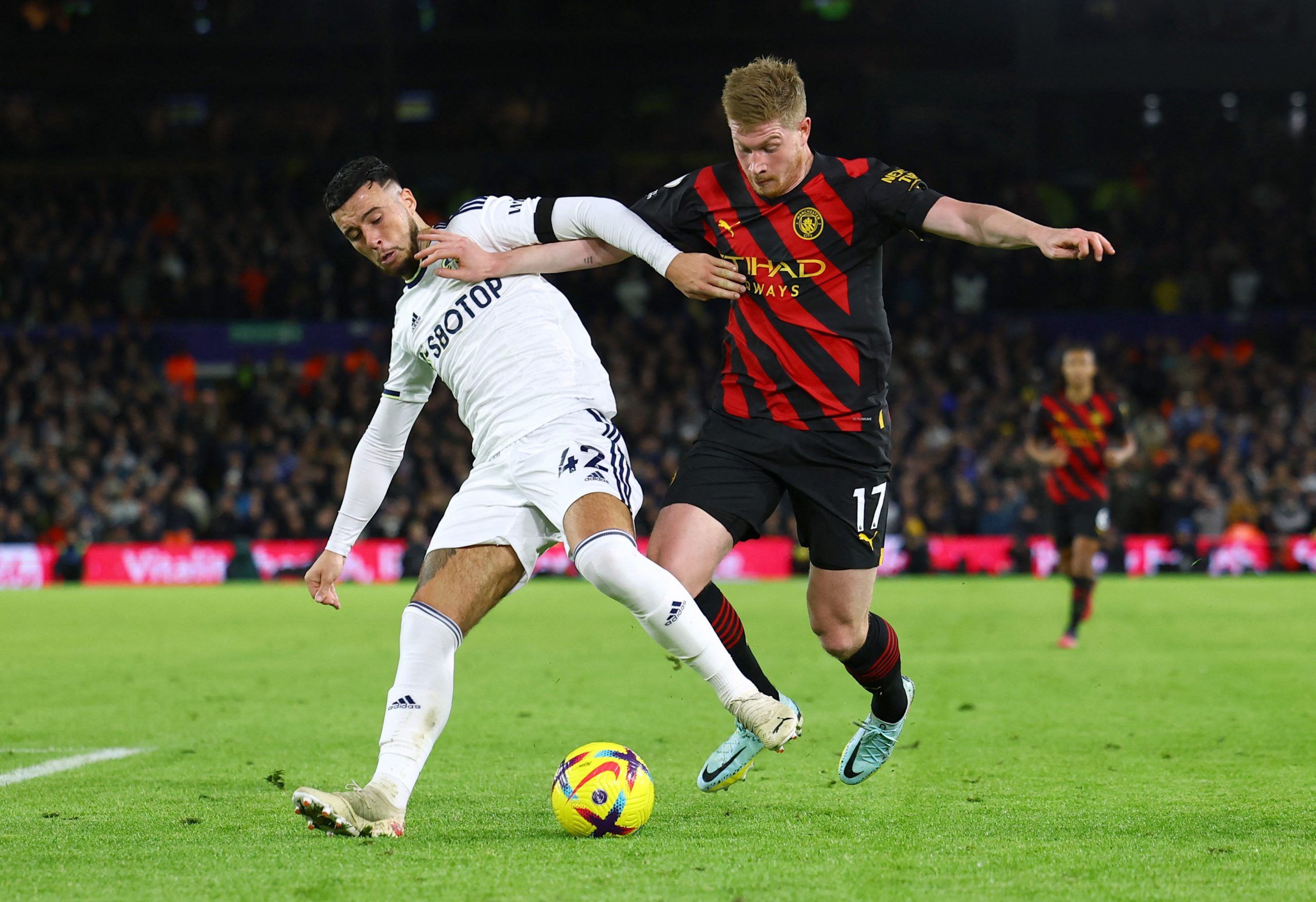 Leeds United's Sam Greenwood in action with Manchester City's Kevin De Bruyne 