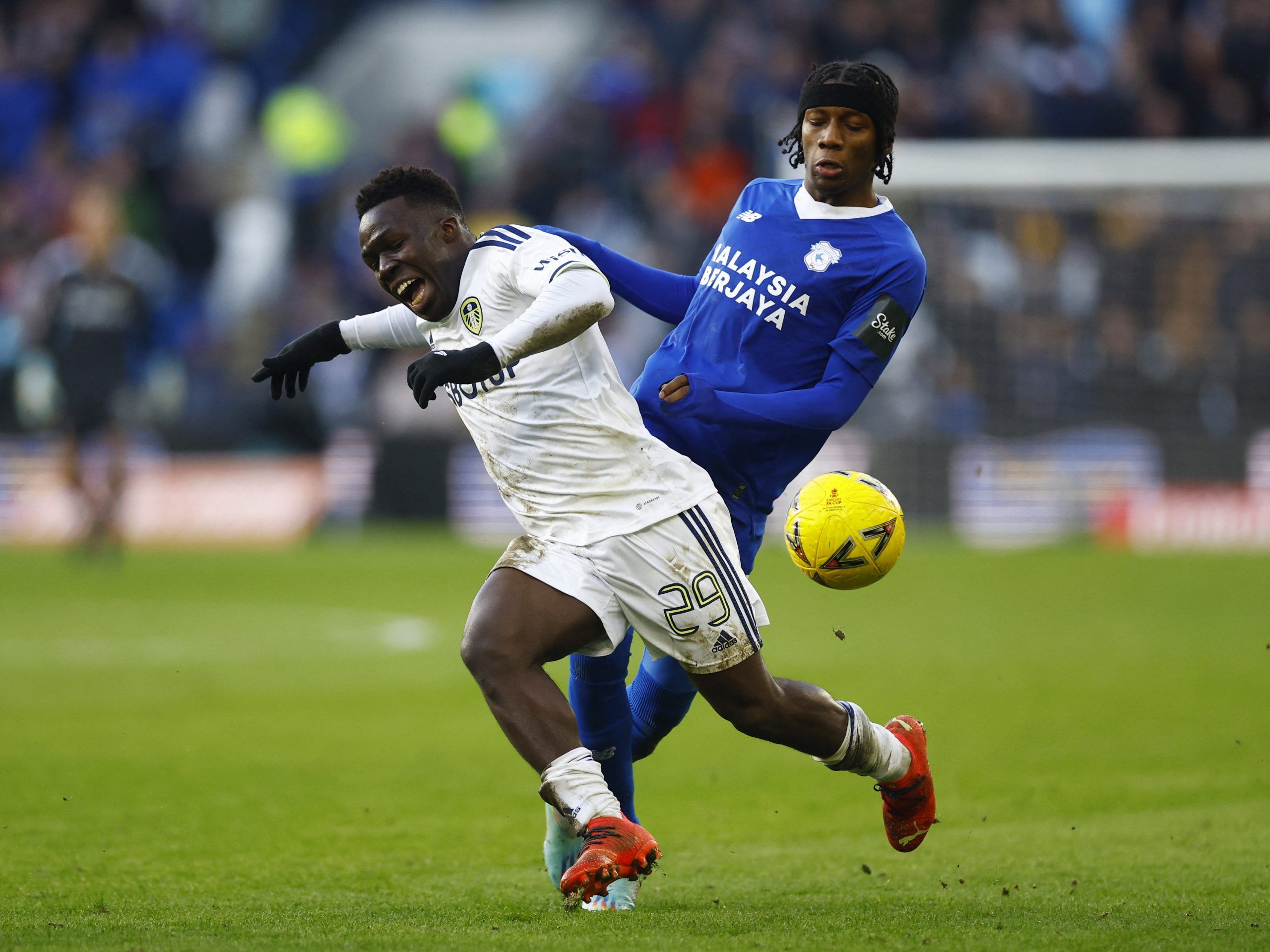 Soccer Football - FA Cup Third Round - Cardiff City v Leeds United - Cardiff City Stadium, Cardiff, Britain - January 8, 2023 Leeds United's Wilfried Gnonto in action with Cardiff City's Jaden Philogene-Bidace Action Images via Reuters/Peter Cziborra