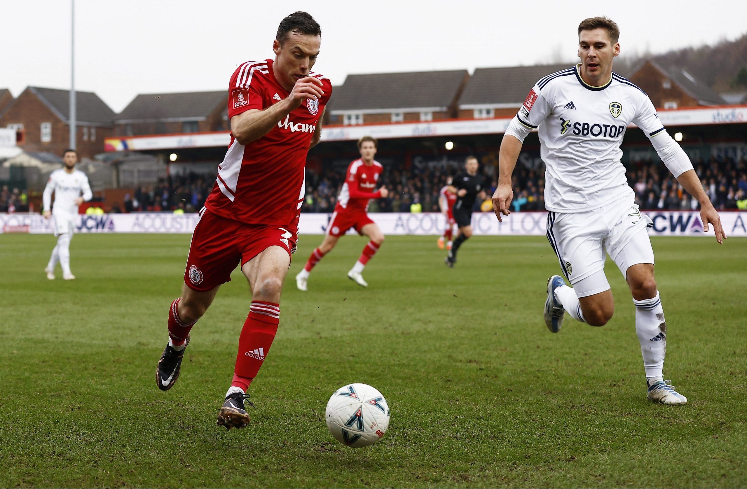Soccer Football - FA Cup - Fourth Round - Accrington Stanley v Leeds United - Wham Stadium, Accrington, Britain - January 28, 2023 Accrington Stanley's Shaun Whalley in action with Leeds United's Maximilian Wöber Action Images via Reuters/Jason Cairnduff