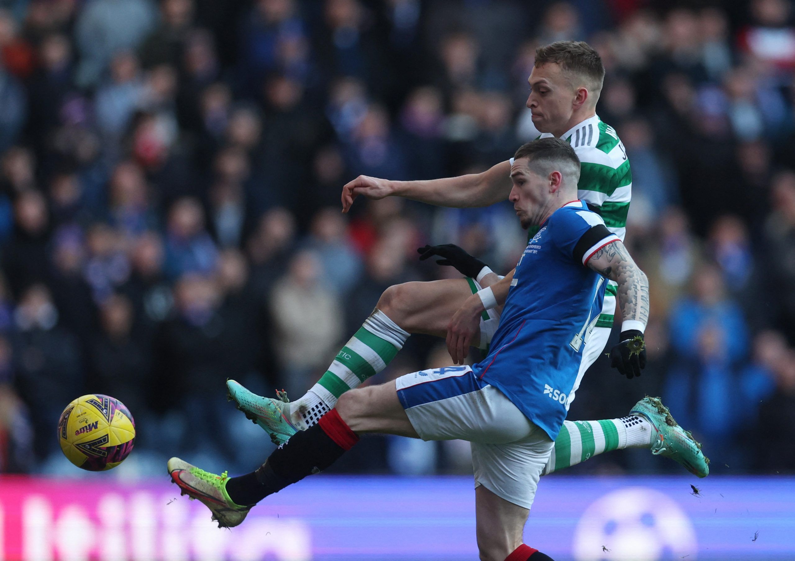 Soccer Football - Scottish Premiership - Rangers vs Celtic - Ibrox, Glasgow, Scotland, Britain - January 2, 2023 Rangers' Ryan Kent in action with Celtic's Alistair Johnston Action Images via Reuters/Lee Smith