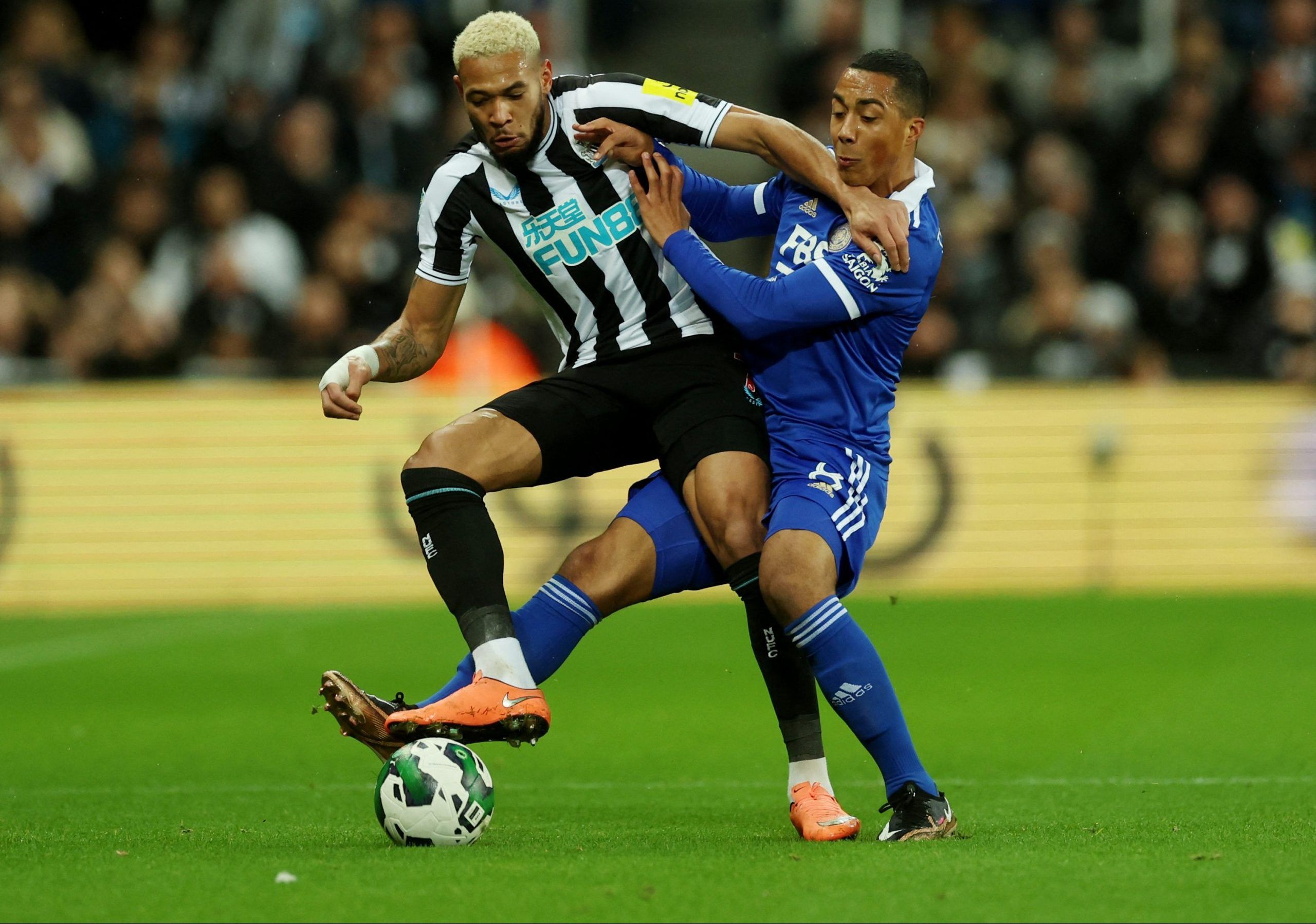Soccer Football - Carabao Cup - Quarter Final - Newcastle United v Leicester City - St James' Park, Newcastle, Britain - January 10, 2023 Newcastle United's Joelinton in action with Leicester City's Youri Tielemans Action Images via Reuters/Lee Smith EDITORIAL USE ONLY. No use with unauthorized audio, video, data, fixture lists, club/league logos or 'live' services. Online in-match use limited to 75 images, no video emulation. No use in betting, games or single club /league/player publications. 
