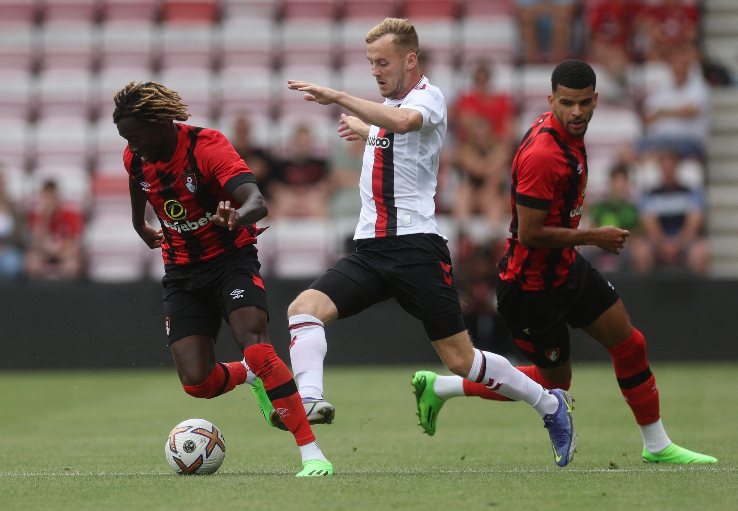 Soccer Football - Pre Season Friendly - AFC Bournemouth v Bristol City - Vitality Stadium, Bournemouth, Britain - July 23, 2022 AFC Bournemouth's Jordan Zemura in action with Bristol City's Alex Scott Action Images via Reuters/Paul Childs