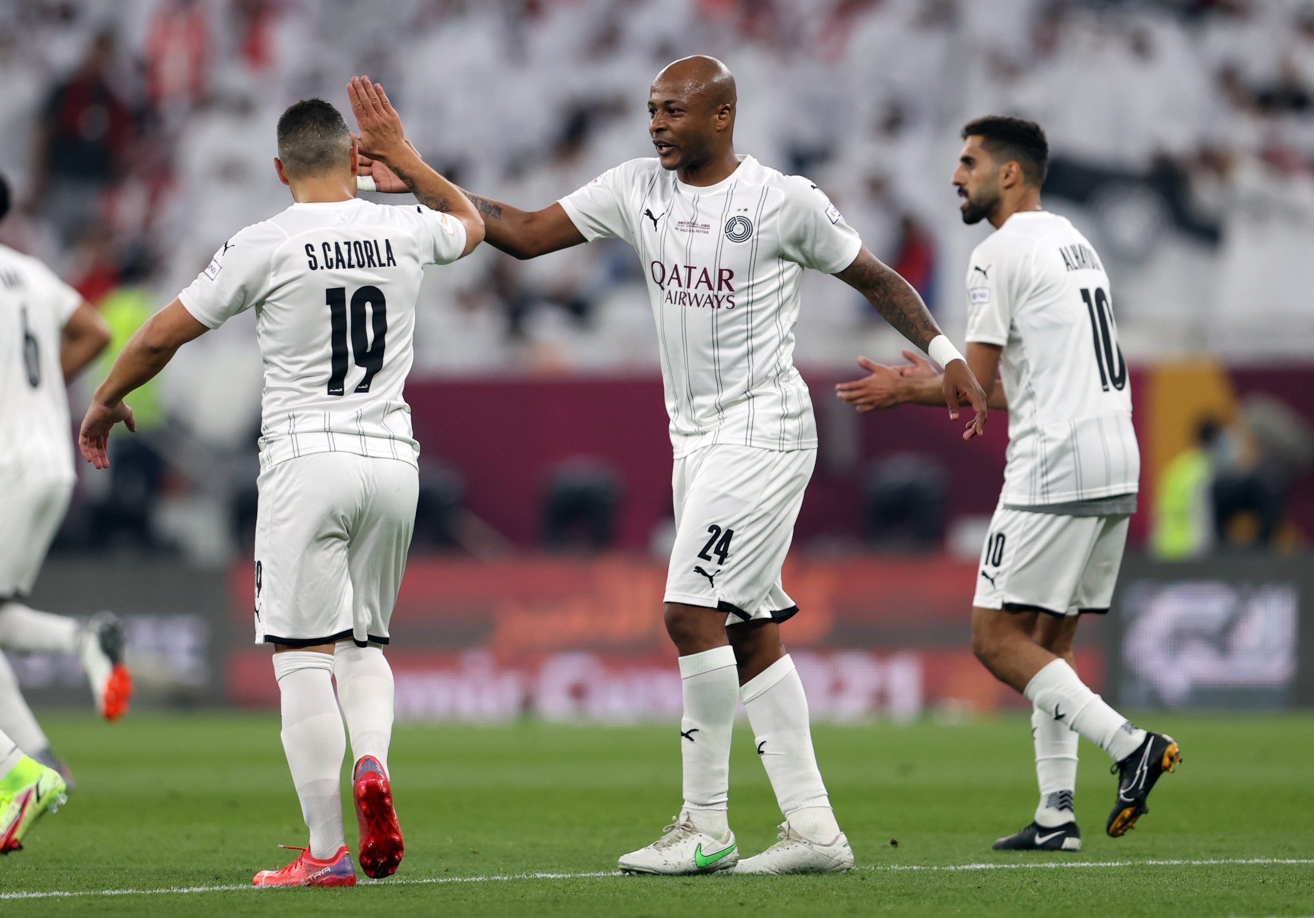 Soccer Football - Emir Cup - Final - Al Sadd v Al Rayyan - Al Thumama Stadium, Al Thumama, Qatar - October 22, 2021 Al Sadd's Santi Cazorla celebrates scoring their first goal with Andre Ayew REUTERS/Ibraheem Al Omari