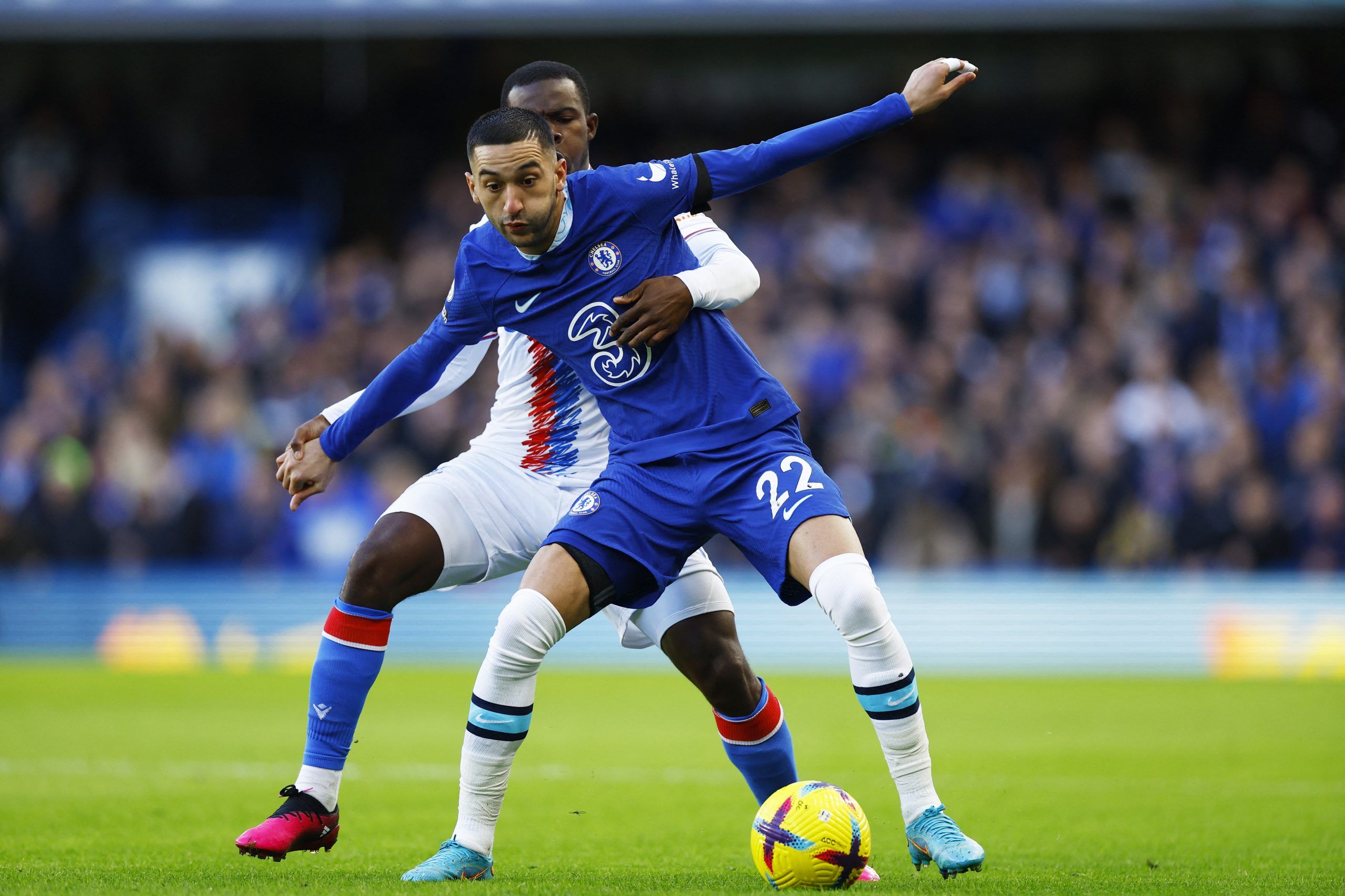 Soccer Football - Premier League - Chelsea v Crystal Palace - Stamford Bridge, London, Britain - January 15, 2023 Chelsea's Hakim Ziyech in action with Crystal Palace's Tyrick Mitchell Action Images via REUTERS/Peter Cziborra EDITORIAL USE ONLY. No use with unauthorized audio, video, data, fixture lists, club/league logos or 'live' services. Online in-match use limited to 75 images, no video emulation. No use in betting, games or single club /league/player publications.  Please contact your acco