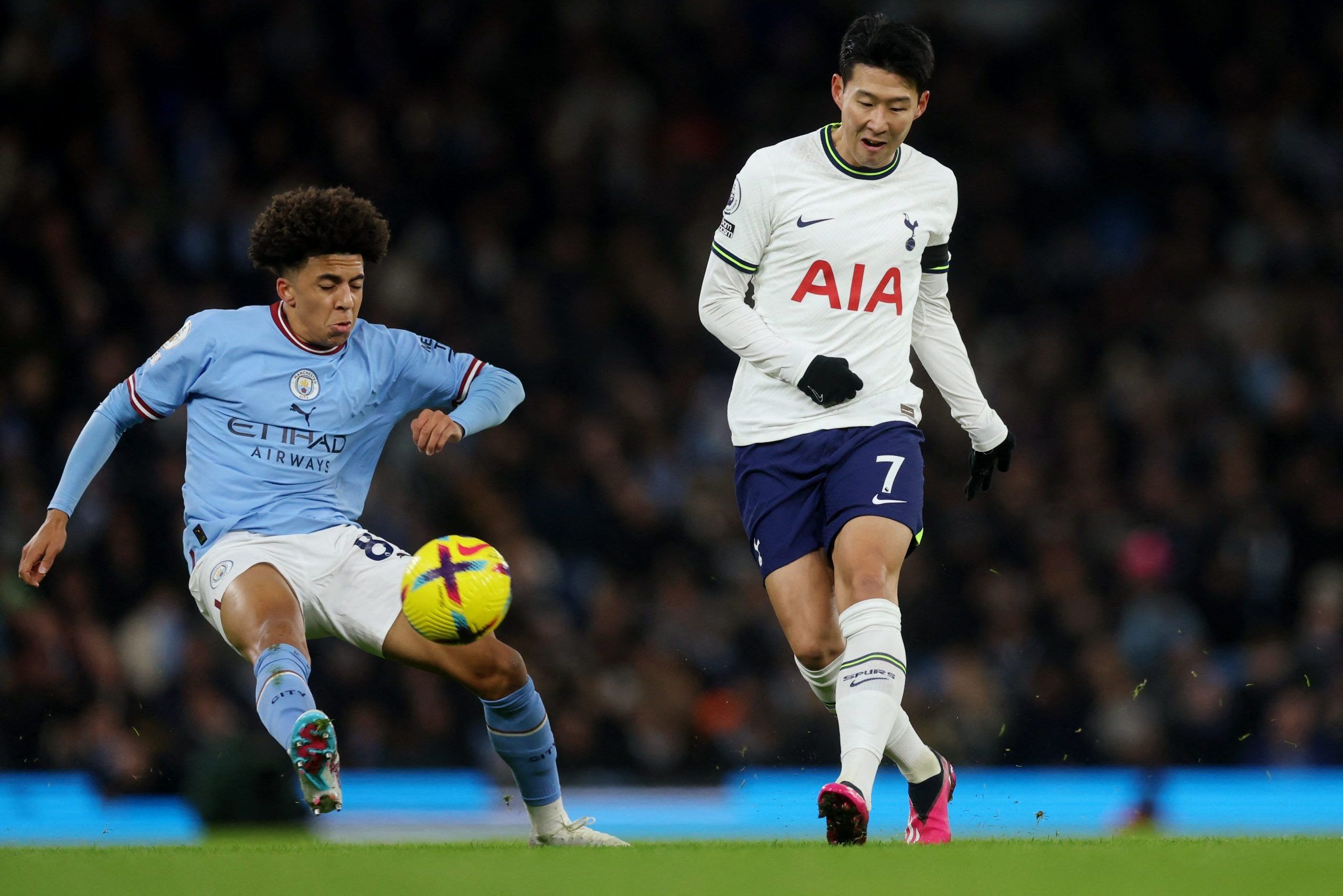 Soccer Football - Premier League - Manchester City v Tottenham Hotspur - Etihad Stadium, Manchester, Britain - January 19, 2023 Manchester City's Rico Lewis in action with Tottenham Hotspur's Son Heung-min Action Images via Reuters/Lee Smith EDITORIAL USE ONLY. No use with unauthorized audio, video, data, fixture lists, club/league logos or 'live' services. Online in-match use limited to 75 images, no video emulation. No use in betting, games or single club /league/player publications.  Please c