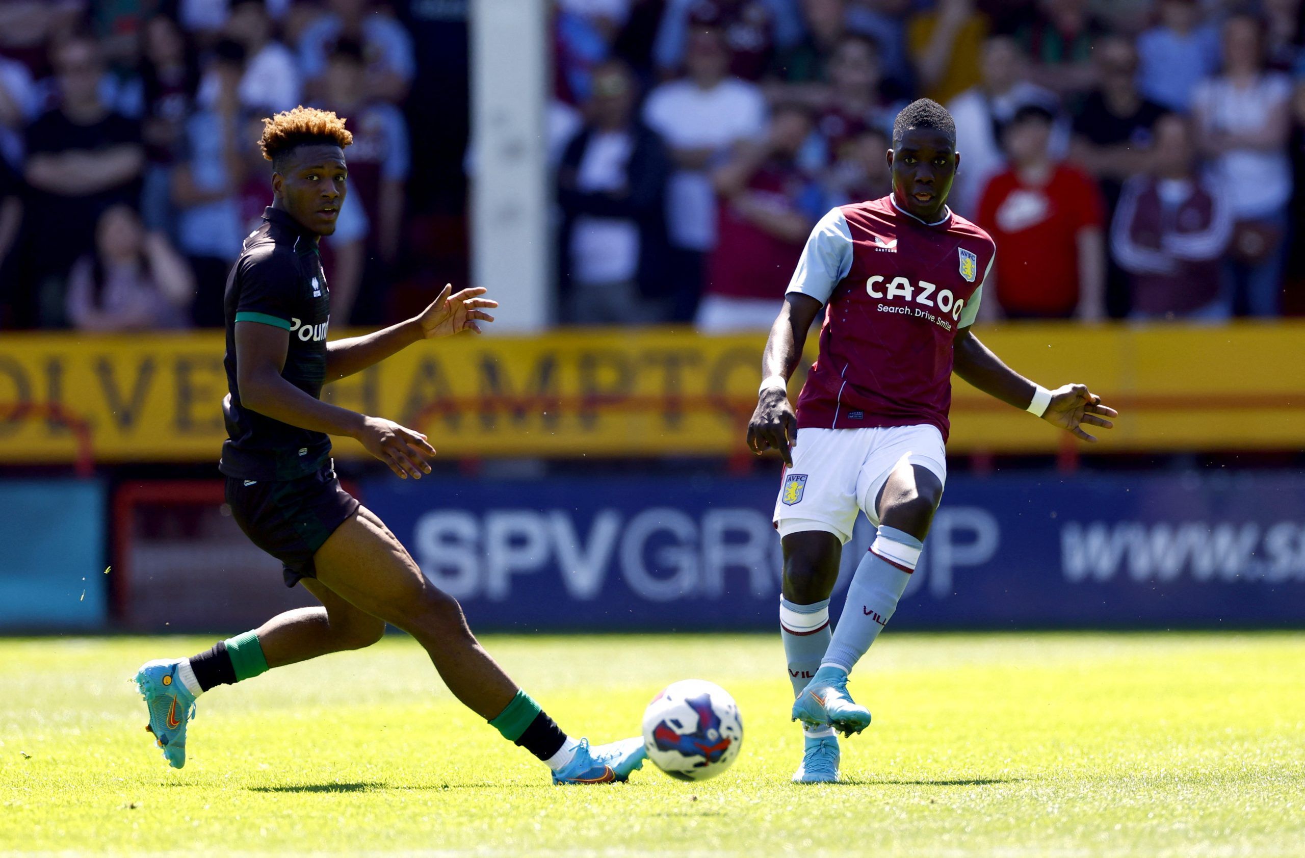 Soccer Football - Pre Season Friendly - Walsall v Aston Villa - Bescot Stadium, Walsall, Britain - July 9, 2022 Walsall's Timmy Abraham in action with Aston Villa's Marvelous Nakamba Action Images via Reuters/Andrew Boyers