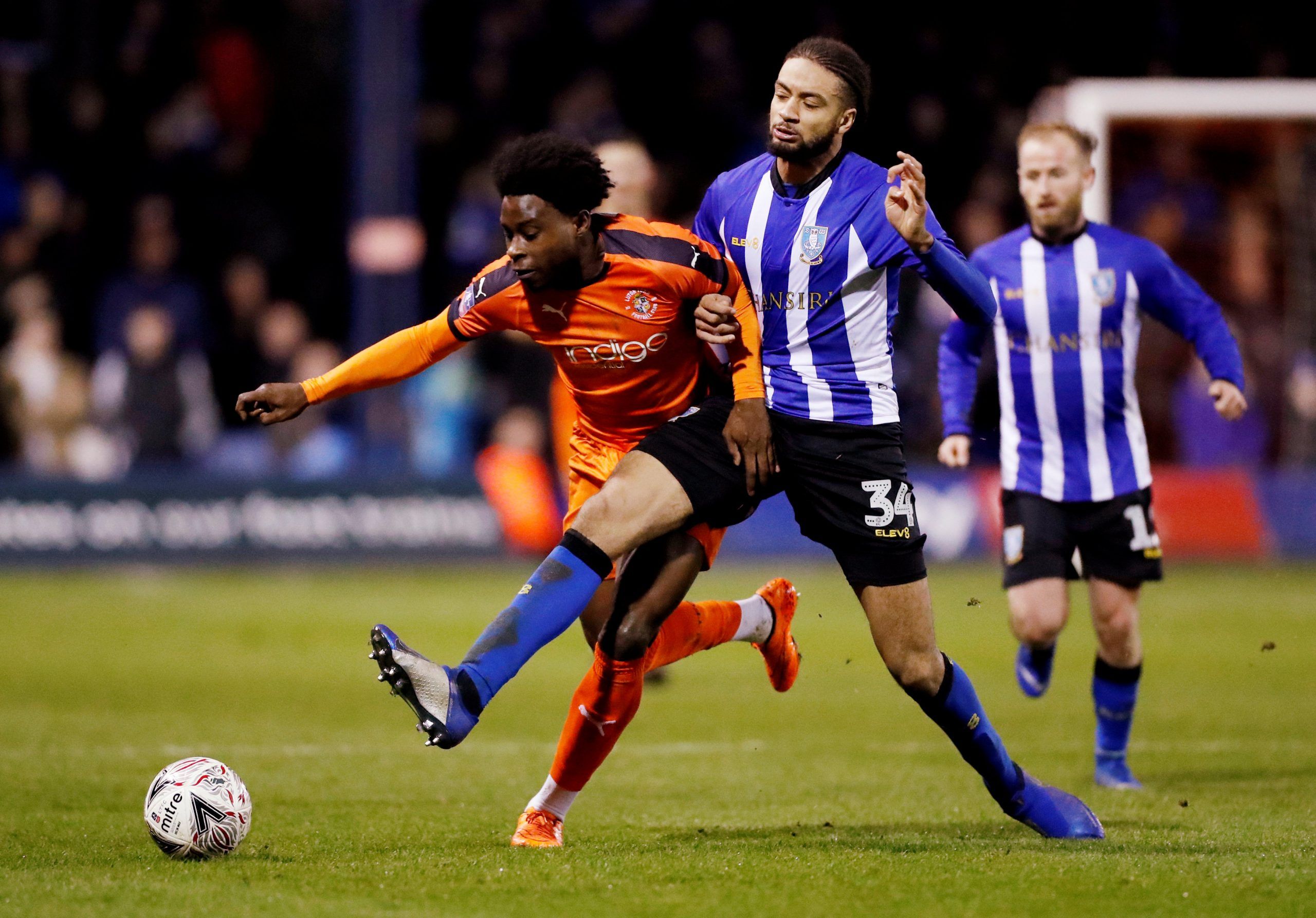 Soccer Football - FA Cup Third Round Replay - Luton Town v Sheffield Wednesday - Kenilworth Road, Luton, Britain - January 15, 2019   Luton Town's Pelly Ruddock in action with Sheffield Wednesday's Michael Hector    Action Images/Peter Cziborra