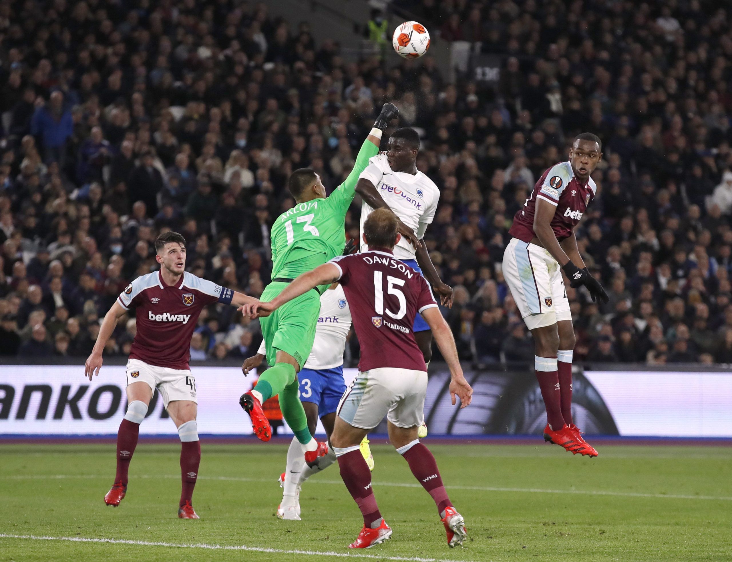 Soccer Football - Europa League - Group H - West Ham United v KRC Genk - London Stadium, London, Britain - October 21, 2021  West Ham United's Alphonse Areola in action with Genk's Paul Onuachu Action Images via Reuters/Andrew Couldridge