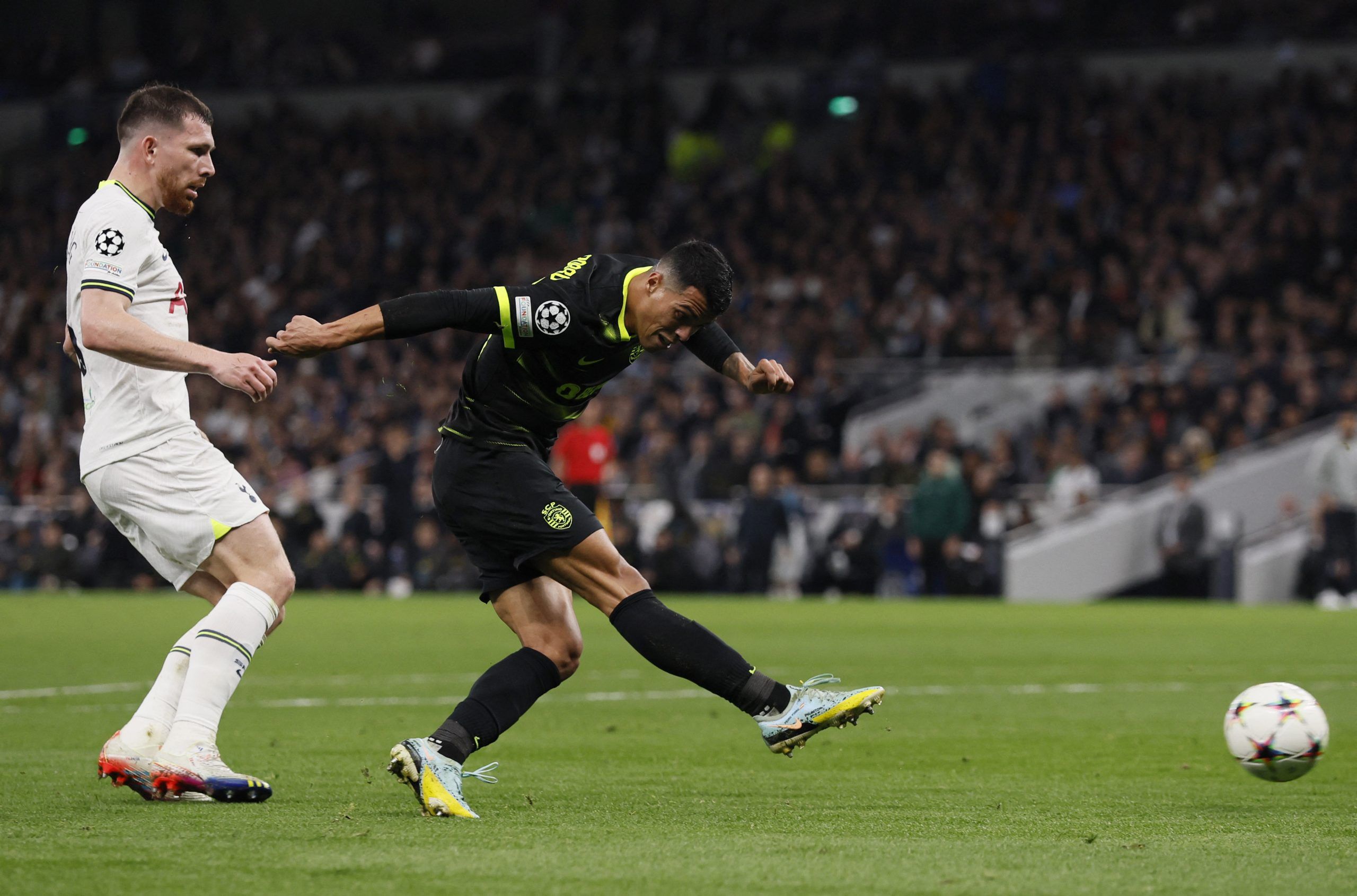 Soccer Football - Champions League - Group D - Tottenham Hotspur v Sporting CP - Tottenham Hotspur Stadium, London, Britain - October 26, 2022  Sporting CP's Pedro Porro in action with Tottenham Hotspur's Pierre-Emile Hojbjerg  Action Images via Reuters/Andrew Couldridge