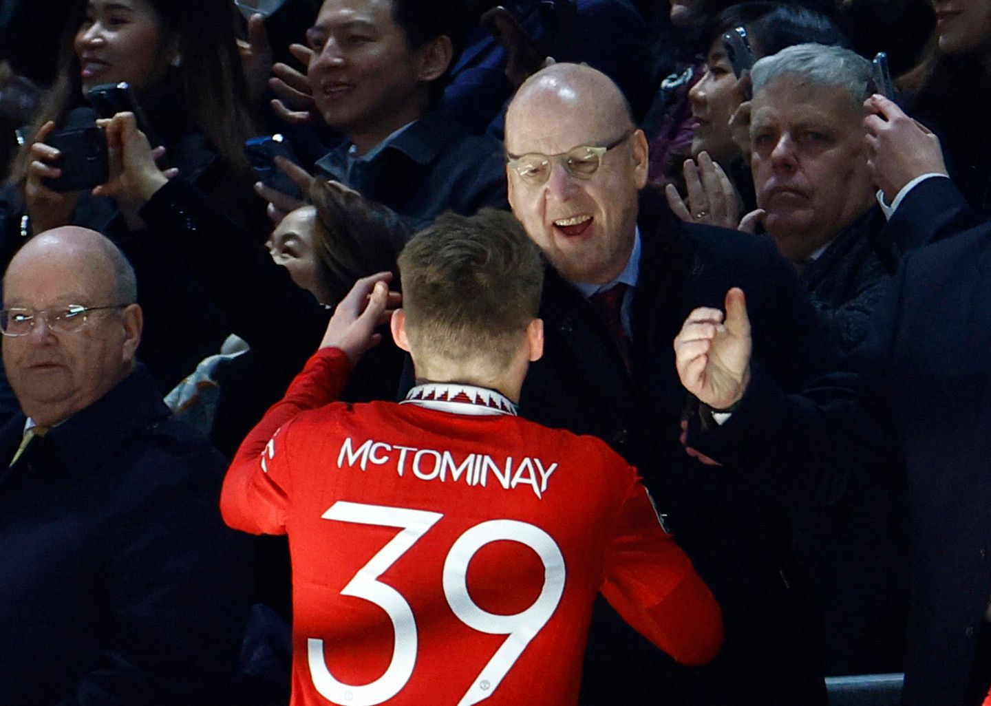 Soccer Football - Carabao Cup - Final - Manchester United v Newcastle United - Wembley Stadium, London, Britain - February 26, 2023  Manchester United's Scott McTominay celebrates with co owner Avram Glazer after winning the Carabao Cup final Action Images via Reuters/John Sibley EDITORIAL USE ONLY. No use with unauthorized audio, video, data, fixture lists, club/league logos or 'live' services. Online in-match use limited to 75 images, no video emulation. No use in betting, games or single club