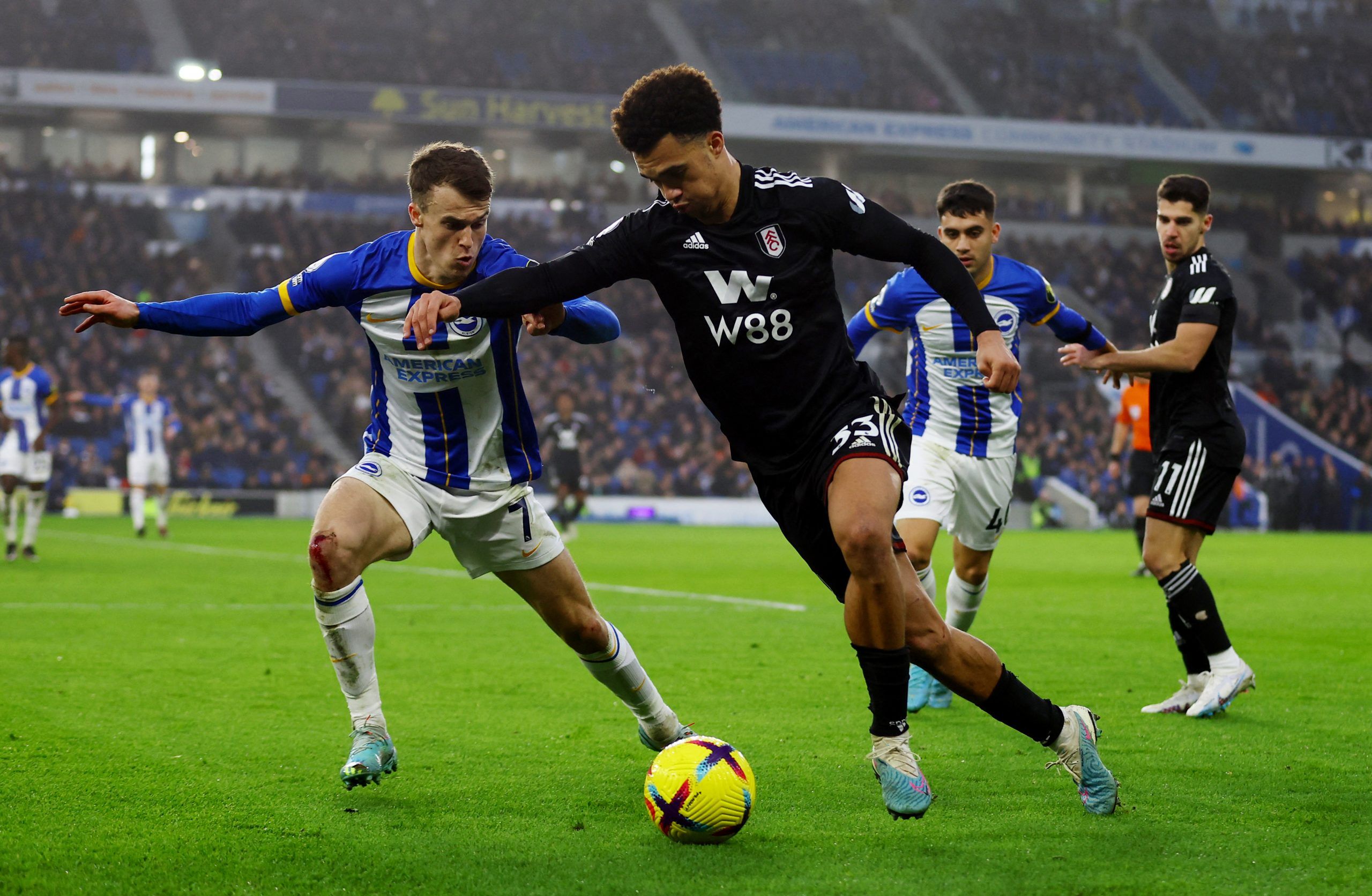 Soccer Football - Premier League - Brighton &amp; Hove Albion v Fulham - The American Express Community Stadium, Brighton, Britain - February 18, 2023 Fulham's Antonee Robinson in action with Brighton &amp; Hove Albion's Solly March Action Images via Reuters/Matthew Childs EDITORIAL USE ONLY. No use with unauthorized audio, video, data, fixture lists, club/league logos or 'live' services. Online in-match use limited to 75 images, no video emulation. No use in betting, games or single club /leagu