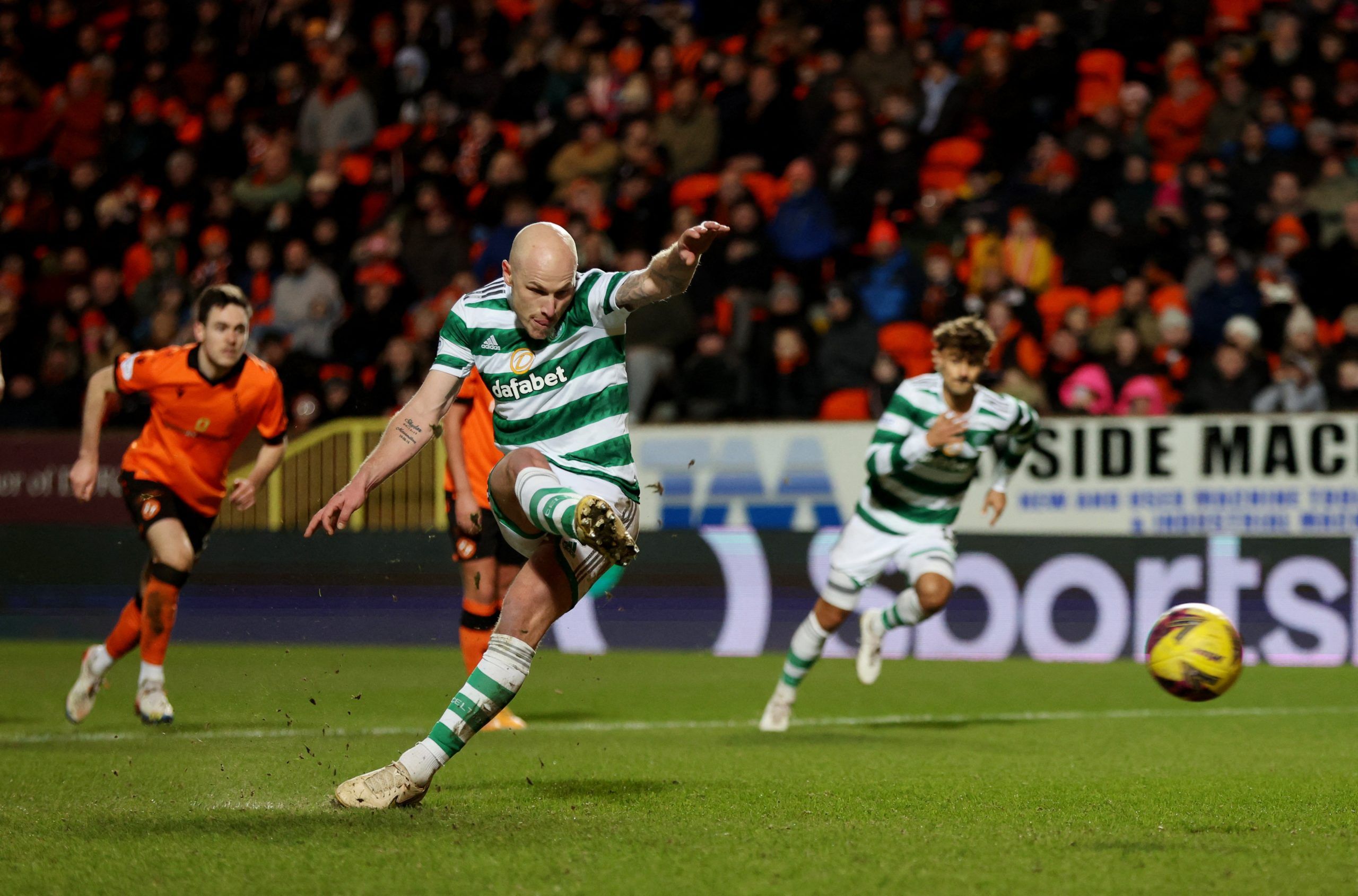 Soccer Football - Scottish Premiership - Dundee United v Celtic - Tannadice Park, Dundee, Scotland, Britain - January 29, 2023 Celtic's Aaron Mooy scores their second goal from the penalty spot REUTERS/Russell Cheyne