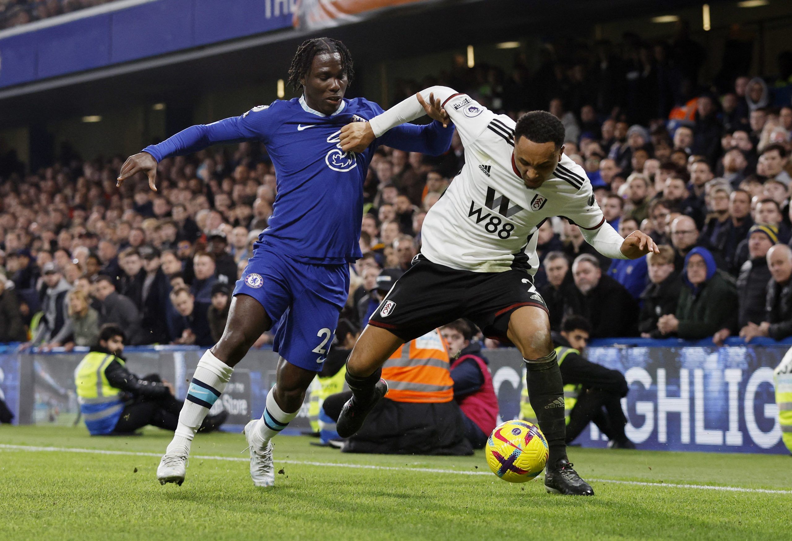 Soccer Football - Premier League - Chelsea v Fulham - Stamford Bridge, London, Britain - February 3, 2023 Chelsea's David Datro Fofana in action with Fulham's Kenny Tete Action Images via Reuters/Andrew Couldridge EDITORIAL USE ONLY. No use with unauthorized audio, video, data, fixture lists, club/league logos or 'live' services. Online in-match use limited to 75 images, no video emulation. No use in betting, games or single club /league/player publications.  Please contact your account represen