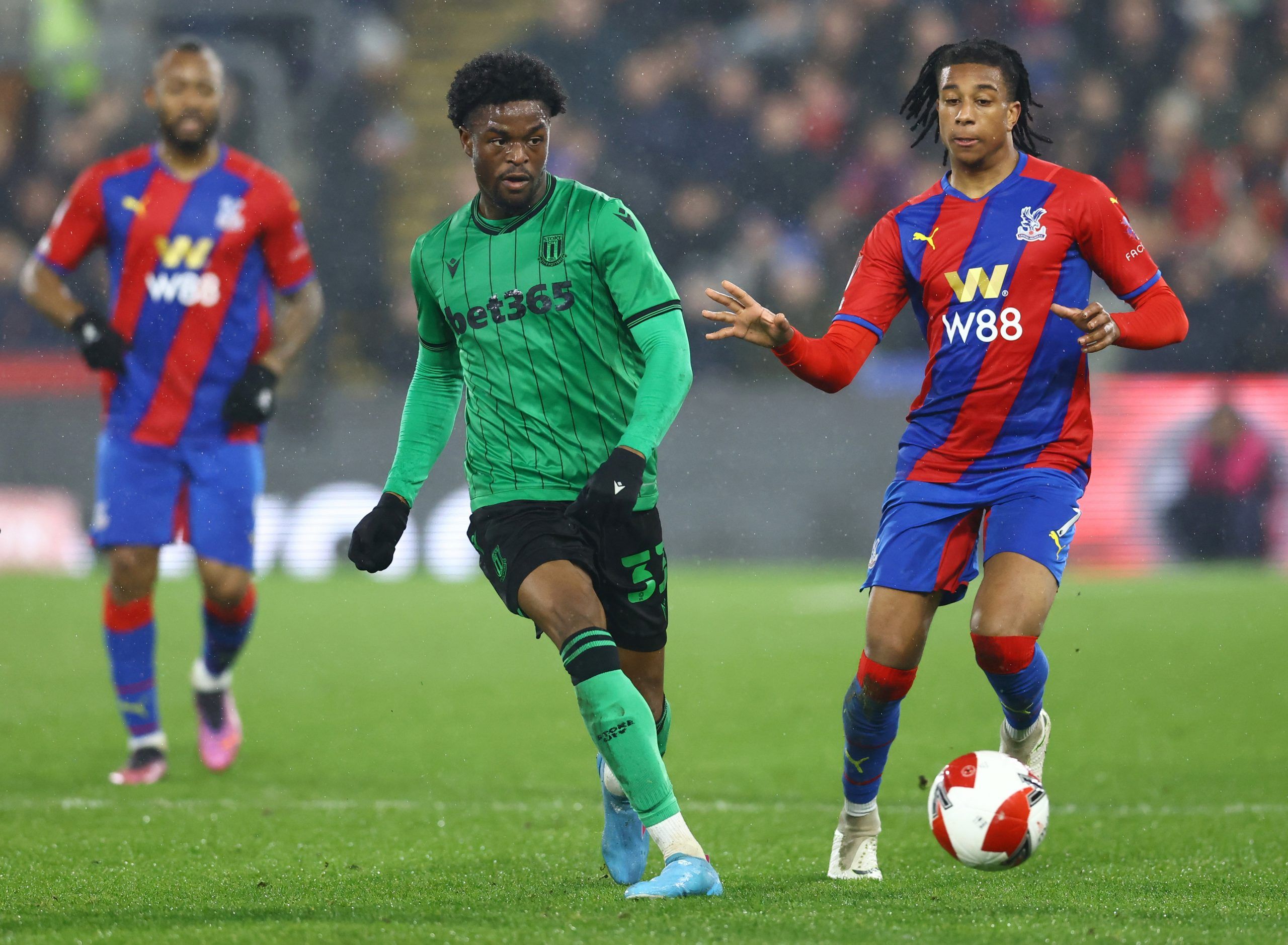 Soccer Football - FA Cup Fifth Round - Crystal Palace v Stoke City - Selhurst Park, London, Britain - March 1, 2022 Stoke City's Josh Maja in action with Crystal Palace's Michael Olise REUTERS/David Klein