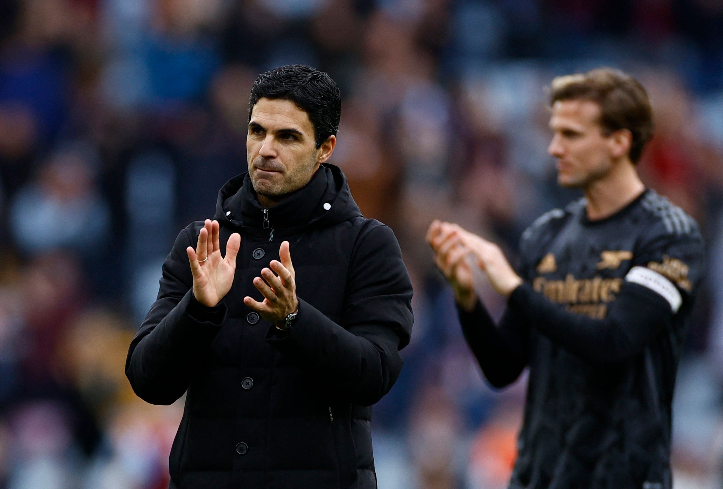 Soccer Football - Premier League - Aston Villa v Arsenal - Villa Park, Birmingham, Britain - February 18, 2023 Arsenal manager Mikel Arteta applauds fans after the match REUTERS/John Sibley EDITORIAL USE ONLY. No use with unauthorized audio, video, data, fixture lists, club/league logos or 'live' services. Online in-match use limited to 75 images, no video emulation. No use in betting, games or single club /league/player publications.  Please contact your account representative for further detai