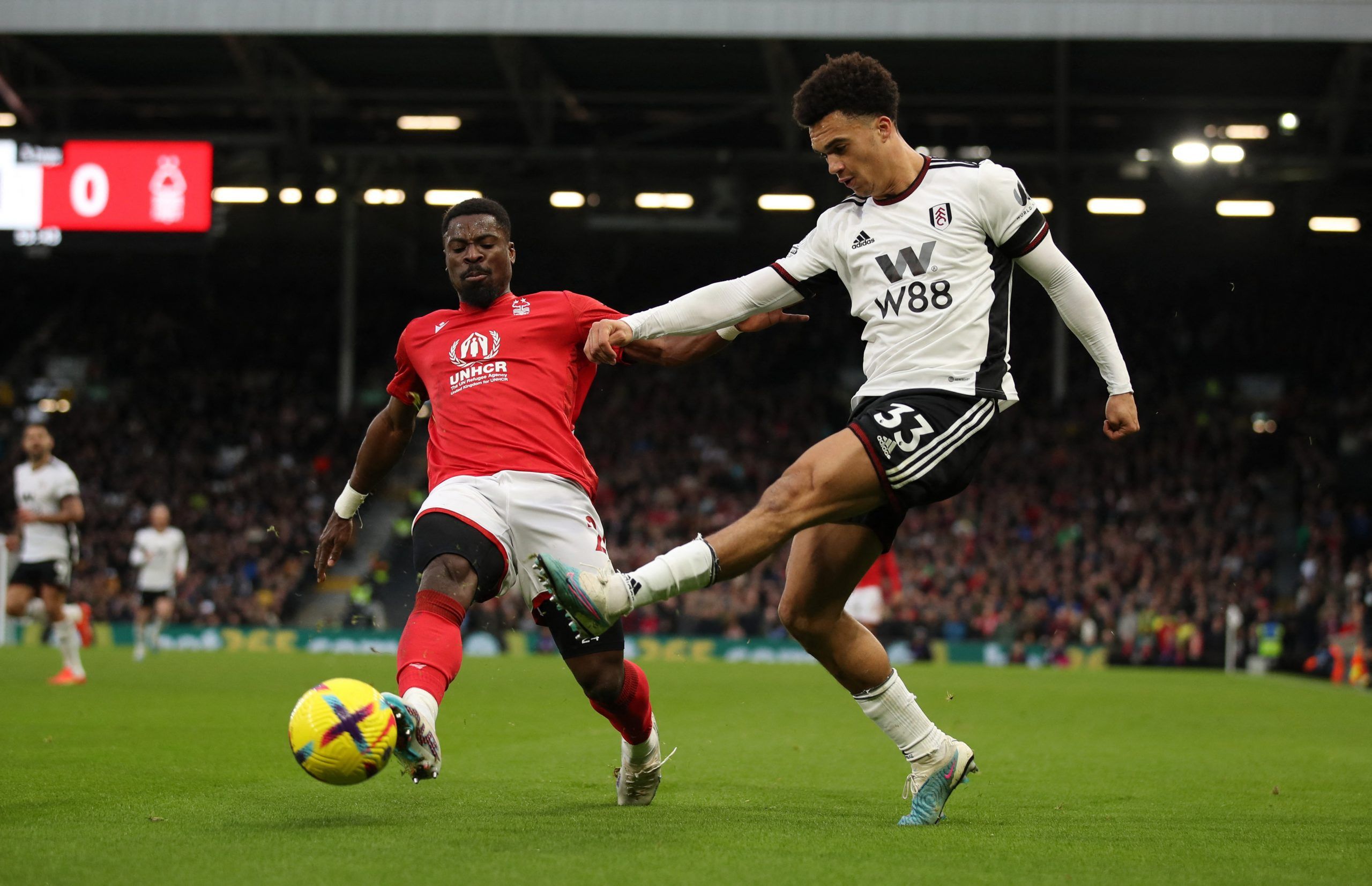 Soccer Football - Premier League - Fulham v Nottingham Forest - Craven Cottage, London, Britain - February 11, 2023 Fulham's Antonee Robinson in action with Nottingham Forest's Serge Aurier REUTERS/Chris Radburn EDITORIAL USE ONLY. No use with unauthorized audio, video, data, fixture lists, club/league logos or 'live' services. Online in-match use limited to 75 images, no video emulation. No use in betting, games or single club /league/player publications.  Please contact your account representa