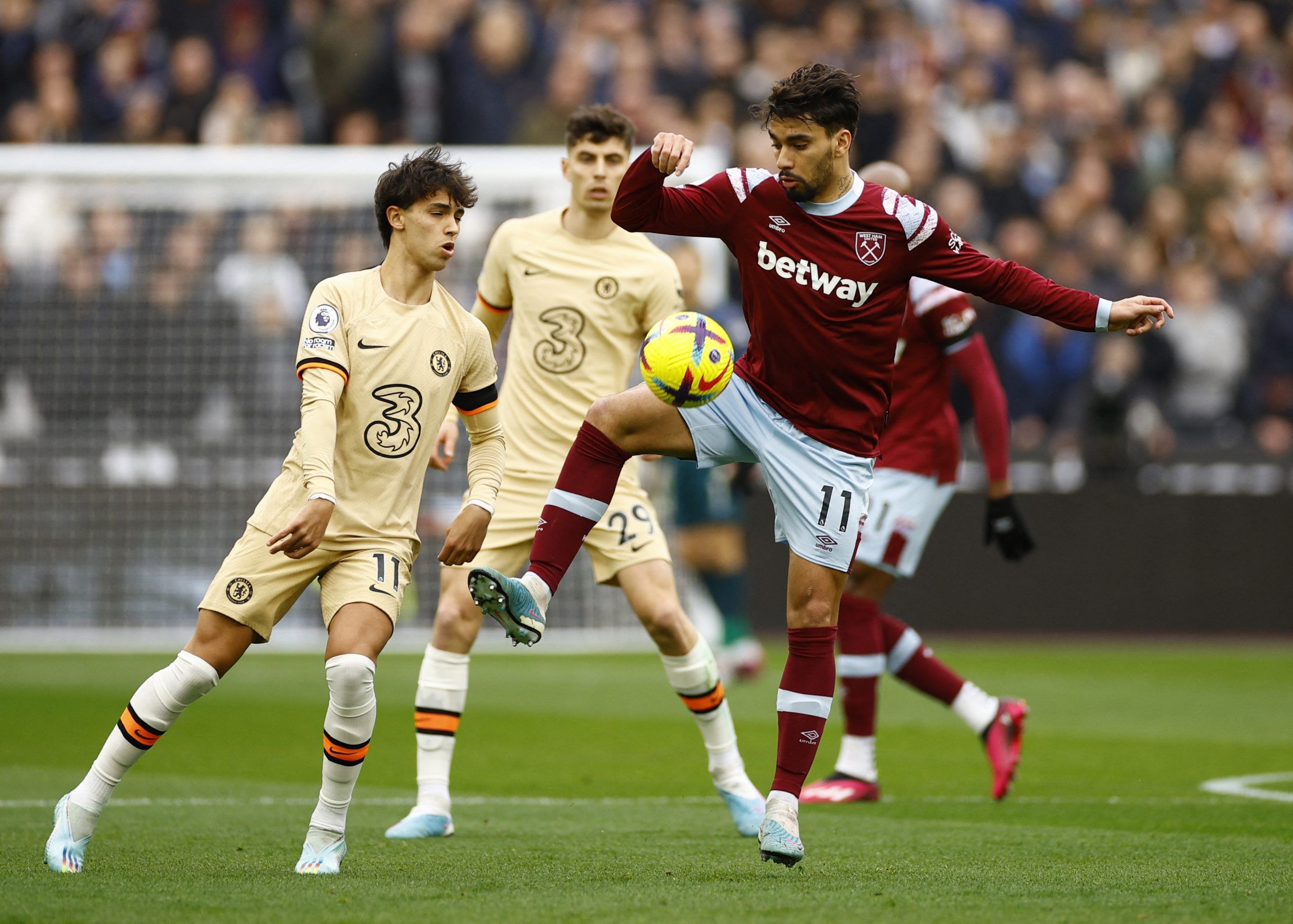 Soccer Football - Premier League - West Ham United v Chelsea - London Stadium, London, Britain - February 11, 2023 Chelsea's Joao Felix in action with West Ham United's Lucas Paqueta Action Images via Reuters/John Sibley EDITORIAL USE ONLY. No use with unauthorized audio, video, data, fixture lists, club/league logos or 'live' services. Online in-match use limited to 75 images, no video emulation. No use in betting, games or single club /league/player publications.  Please contact your account r