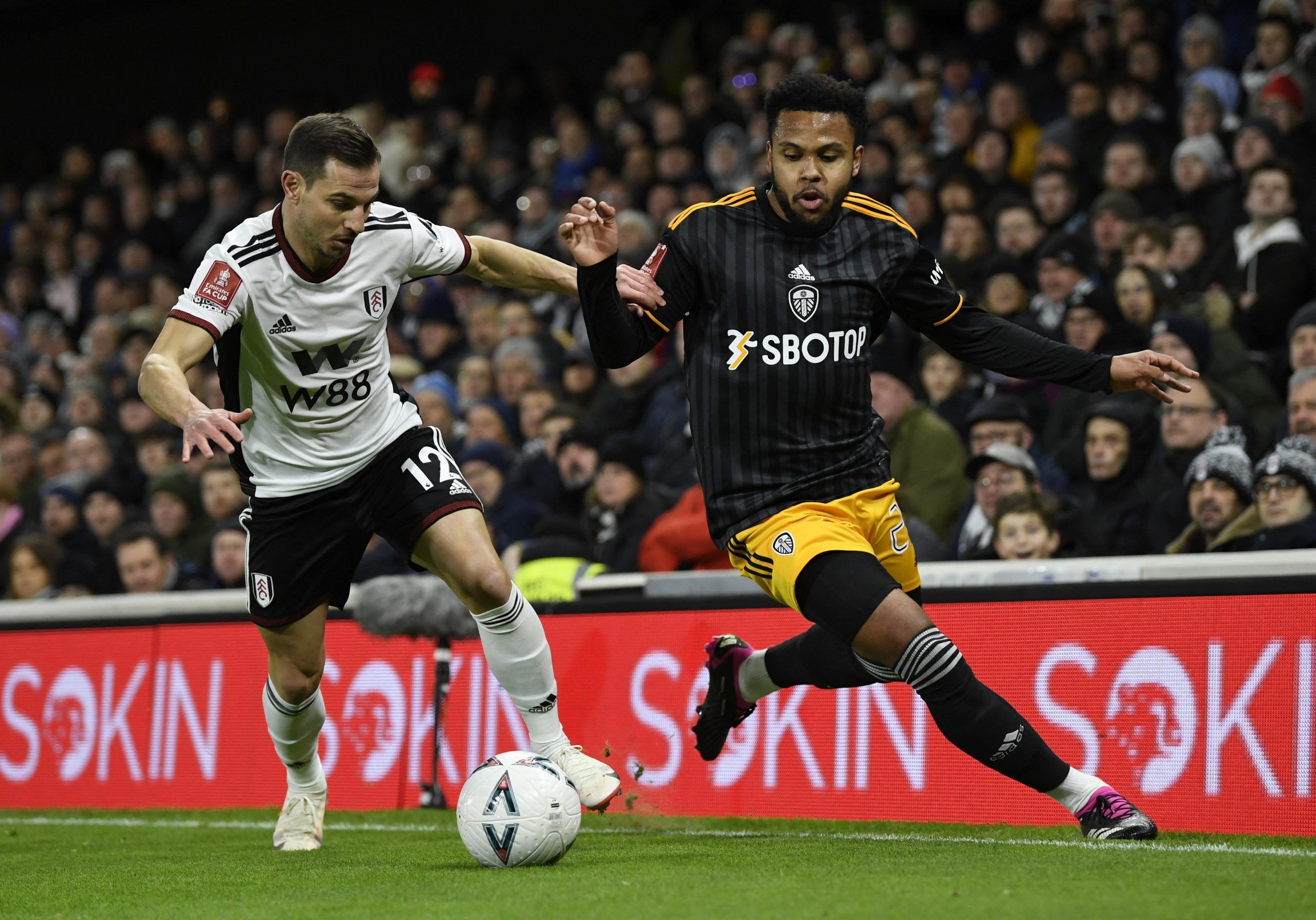 Soccer Football - FA Cup - Fifth Round - Fulham v Leeds United - Craven Cottage, London, Britain - February 28, 2023 Fulham's Cedric Soares in action with Leeds United's Weston McKennie REUTERS/Tony Obrien