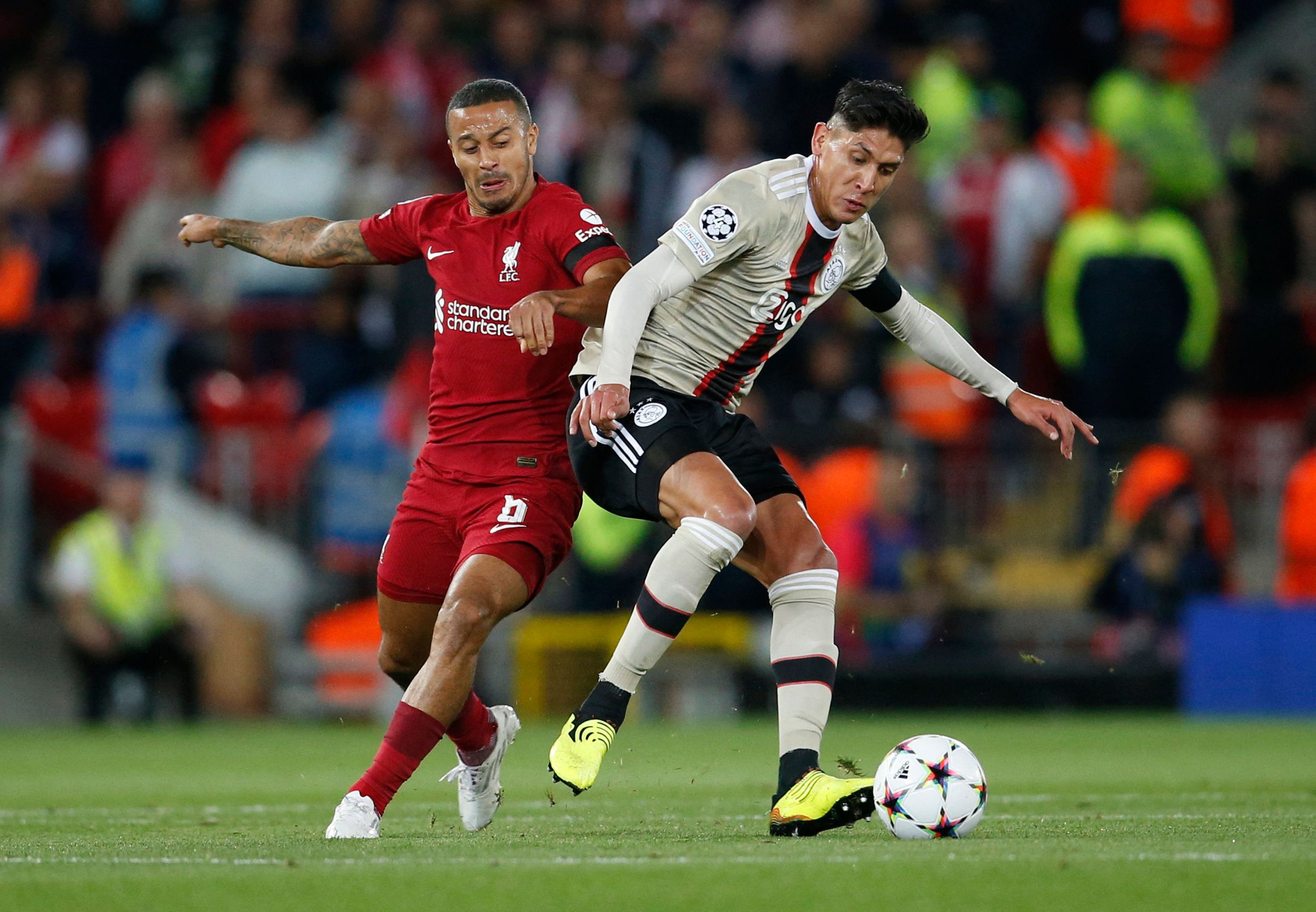 Soccer Football - Champions League - Group A - Liverpool v Ajax Amsterdam - Anfield, Liverpool, Britain - September 13, 2022  Liverpool's Thiago Alcantara in action with Ajax Amsterdam's Edson Alvarez Action Images via Reuters/Ed Sykes