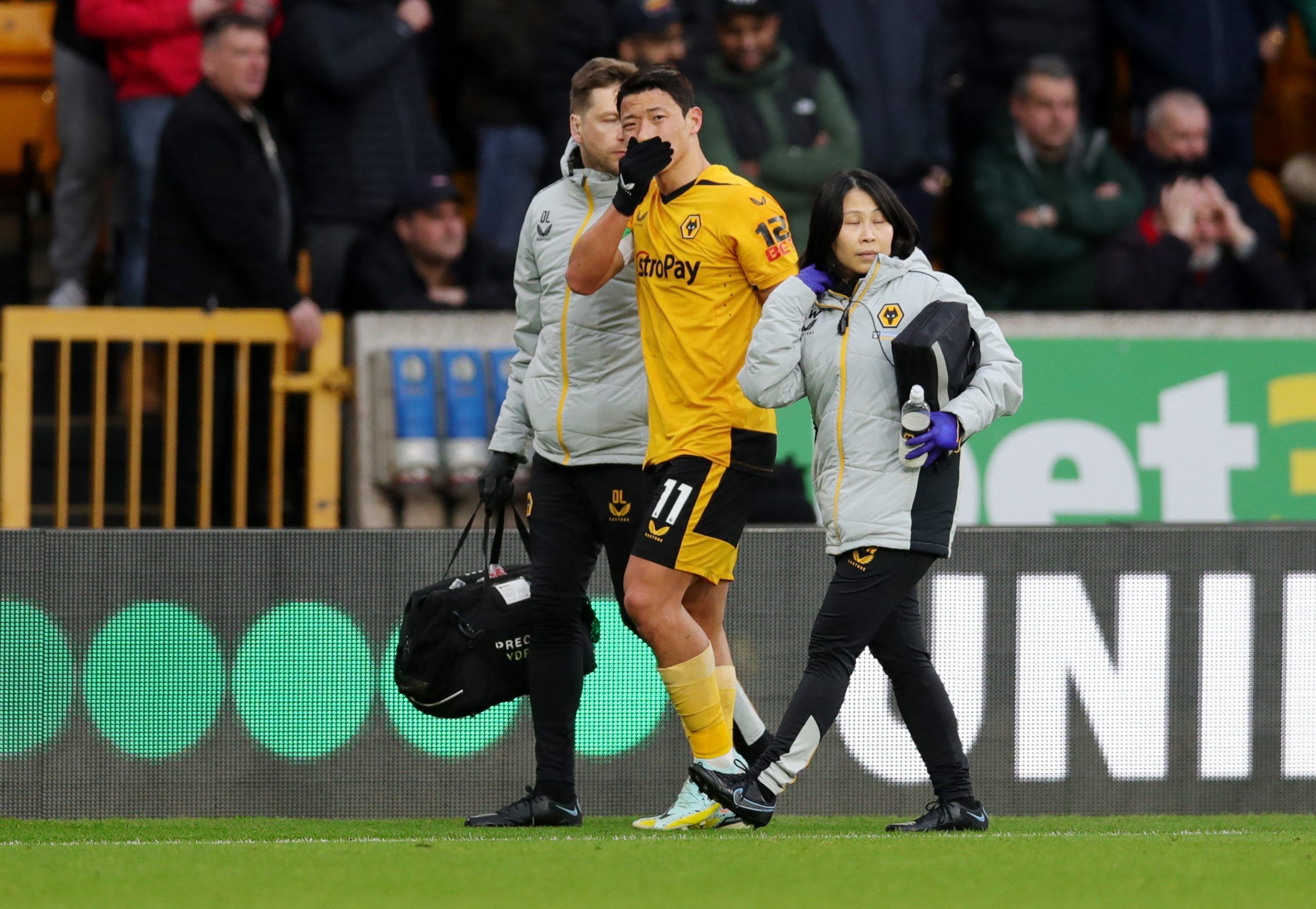 Soccer Football - Premier League - Wolverhampton Wanderers v Liverpool - Molineux Stadium, Wolverhampton, Britain - February 4, 2023 Wolverhampton Wanderers' Hwang Hee-chan after sustaining an injury REUTERS/Chris Radburn EDITORIAL USE ONLY. No use with unauthorized audio, video, data, fixture lists, club/league logos or 'live' services. Online in-match use limited to 75 images, no video emulation. No use in betting, games or single club /league/player publications.  Please contact your account 