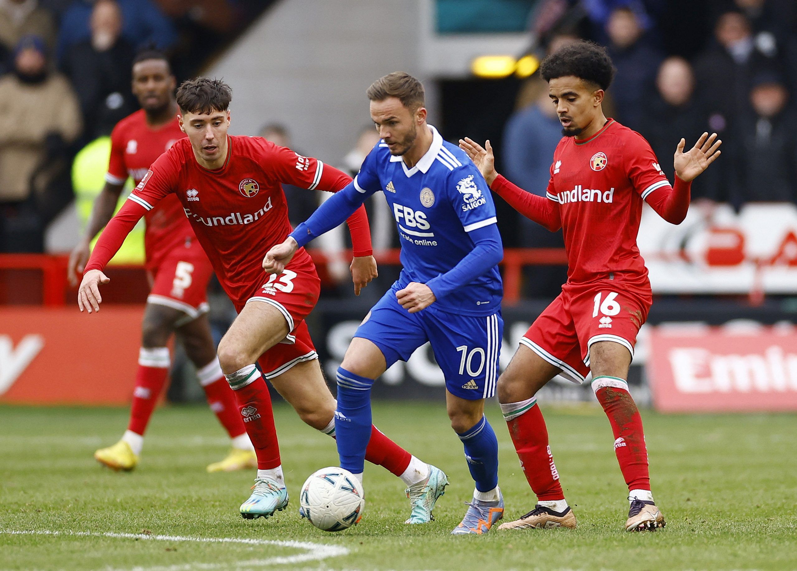 Soccer Football - FA Cup - Fourth Round - Walsall v Leicester City - Bescot Stadium, Walsall, Britain - January 28, 2023 Leicester City's James Maddison in action with Walsall's Isaac Hutchinson and Jacob Maddox Action Images via Reuters/Andrew Boyers