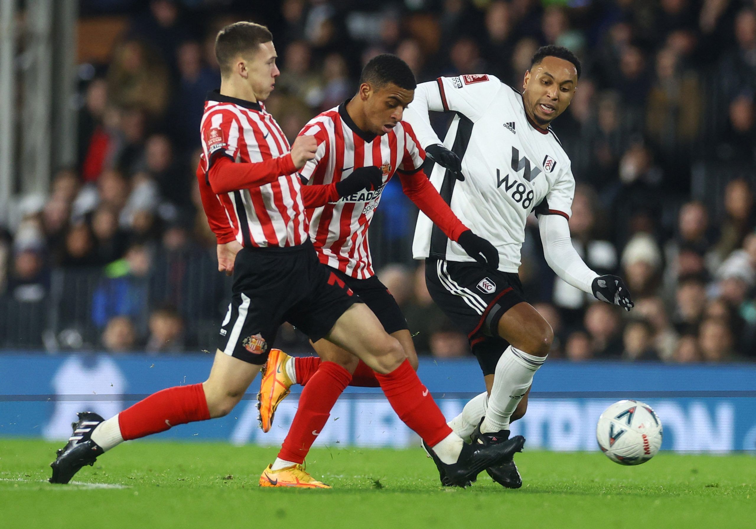 Soccer Football - FA Cup - Fourth Round - Fulham v Sunderland - Craven Cottage, London, Britain - January 28, 2023 Sunderland's Jewison Bennette in action with Fulham's Kenny Tete Action Images via Reuters/Paul Childs