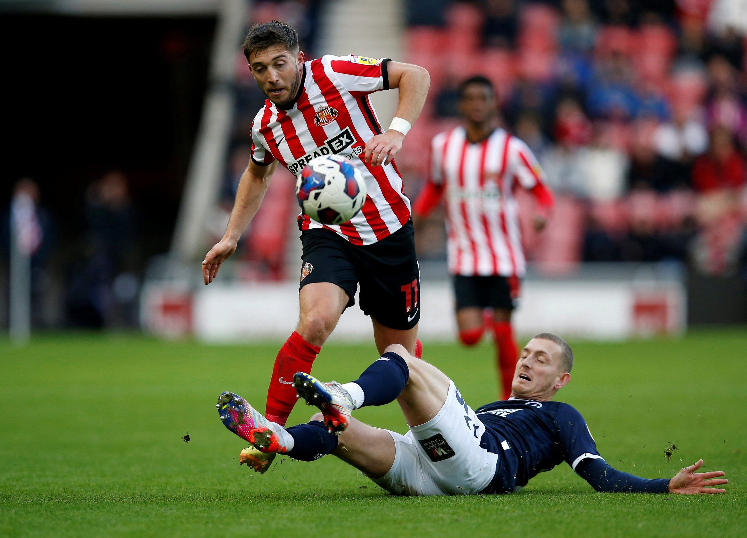 Soccer Football - Championship - Sunderland v Millwall - Stadium of Light, Sunderland, Britain - December 3, 2022  Millwall's George Saville fouls Sunderland's Lynden Gooch before being shown a yellow card Action Images/Craig Brough  EDITORIAL USE ONLY. No use with unauthorized audio, video, data, fixture lists, club/league logos or 