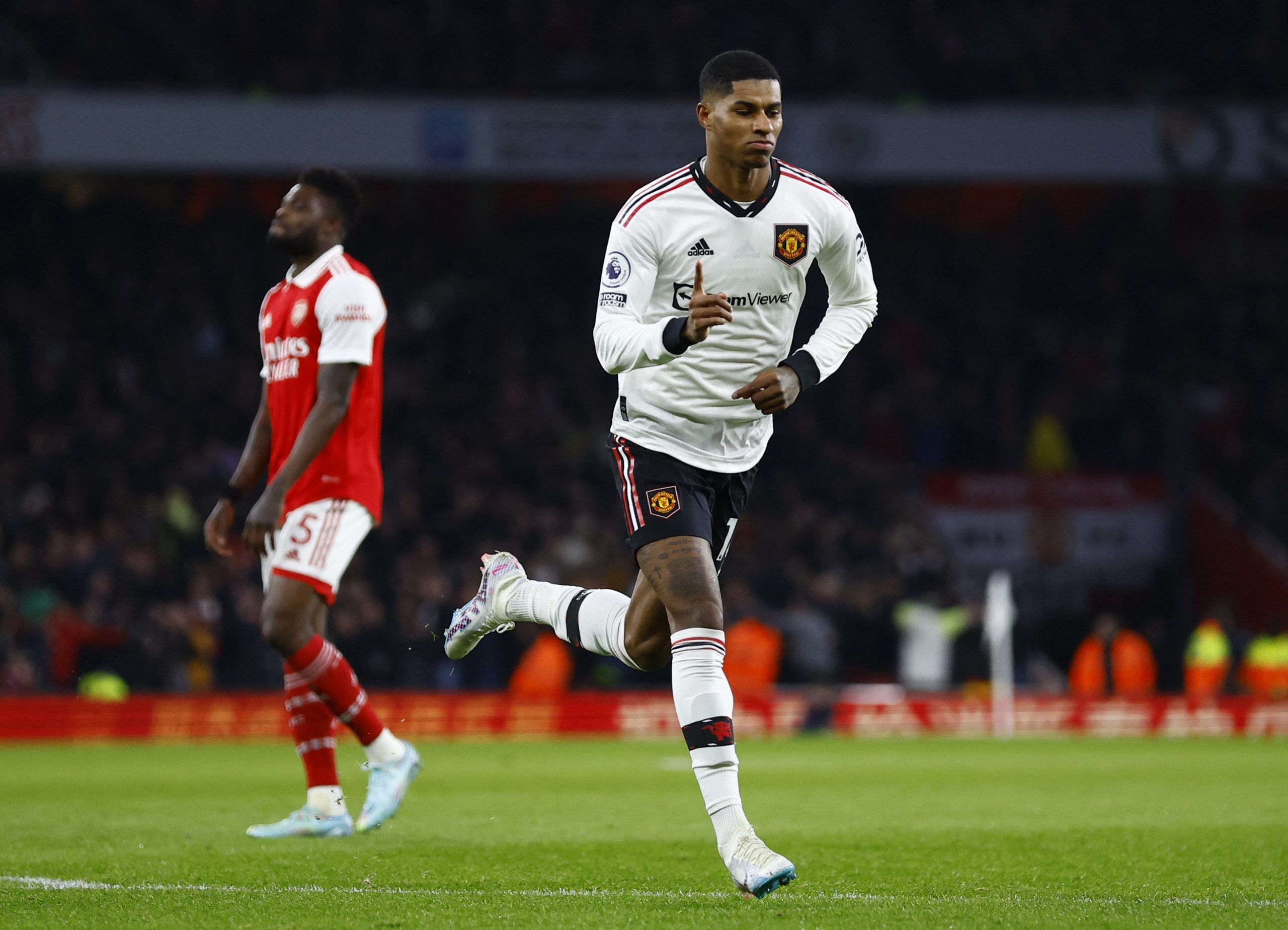 Soccer Football - Premier League - Arsenal v Manchester United - Emirates Stadium, London, Britain - January 22, 2023 Manchester United's Marcus Rashford scores their first goal Action Images via Reuters/Peter Cziborra EDITORIAL USE ONLY. No use with unauthorized audio, video, data, fixture lists, club/league logos or 'live' services. Online in-match use limited to 75 images, no video emulation. No use in betting, games or single club /league/player publications.  Please contact your account rep