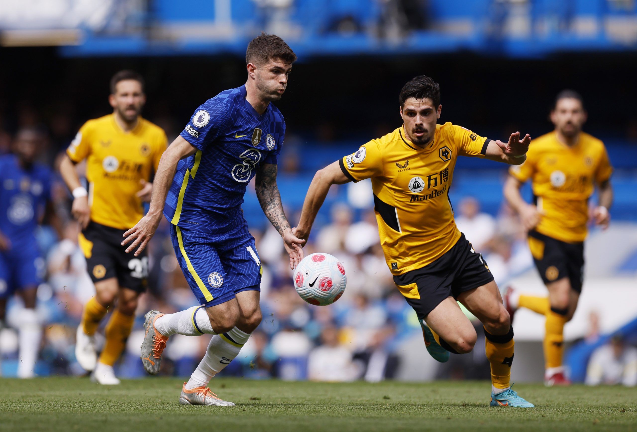 Soccer Football - Premier League - Chelsea v Wolverhampton Wanderers - Stamford Bridge, London, Britain - May 7, 2022 Chelsea's Christian Pulisic in action with Wolverhampton Wanderers' Pedro Neto Action Images via Reuters/Andrew Couldridge EDITORIAL USE ONLY. No use with unauthorized audio, video, data, fixture lists, club/league logos or 'live' services. Online in-match use limited to 75 images, no video emulation. No use in betting, games or single club /league/player publications.  Please co