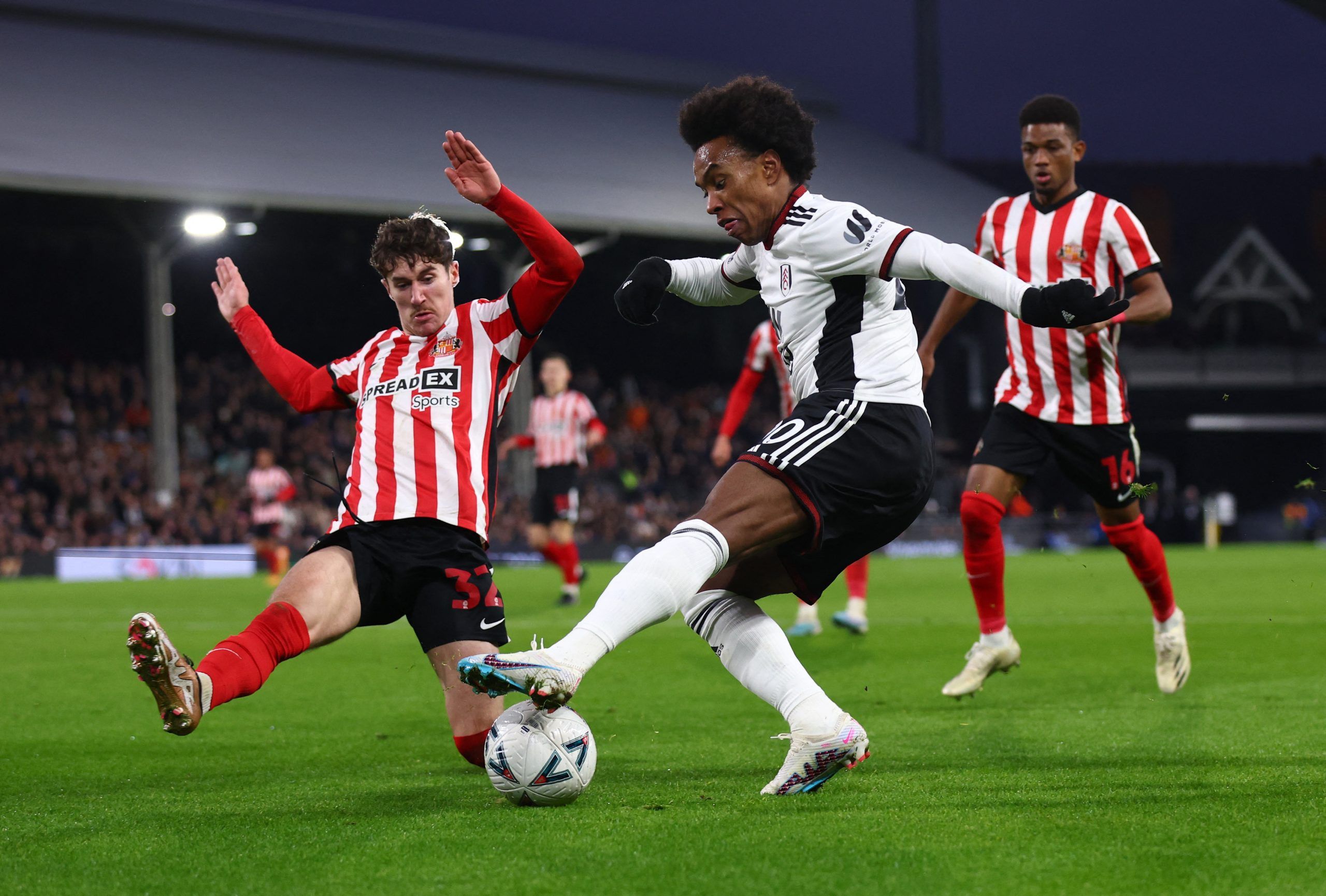 Soccer Football - FA Cup - Fourth Round - Fulham v Sunderland - Craven Cottage, London, Britain - January 28, 2023 Fulham's Willian in action with Sunderland's Trai Hume REUTERS/David Klein