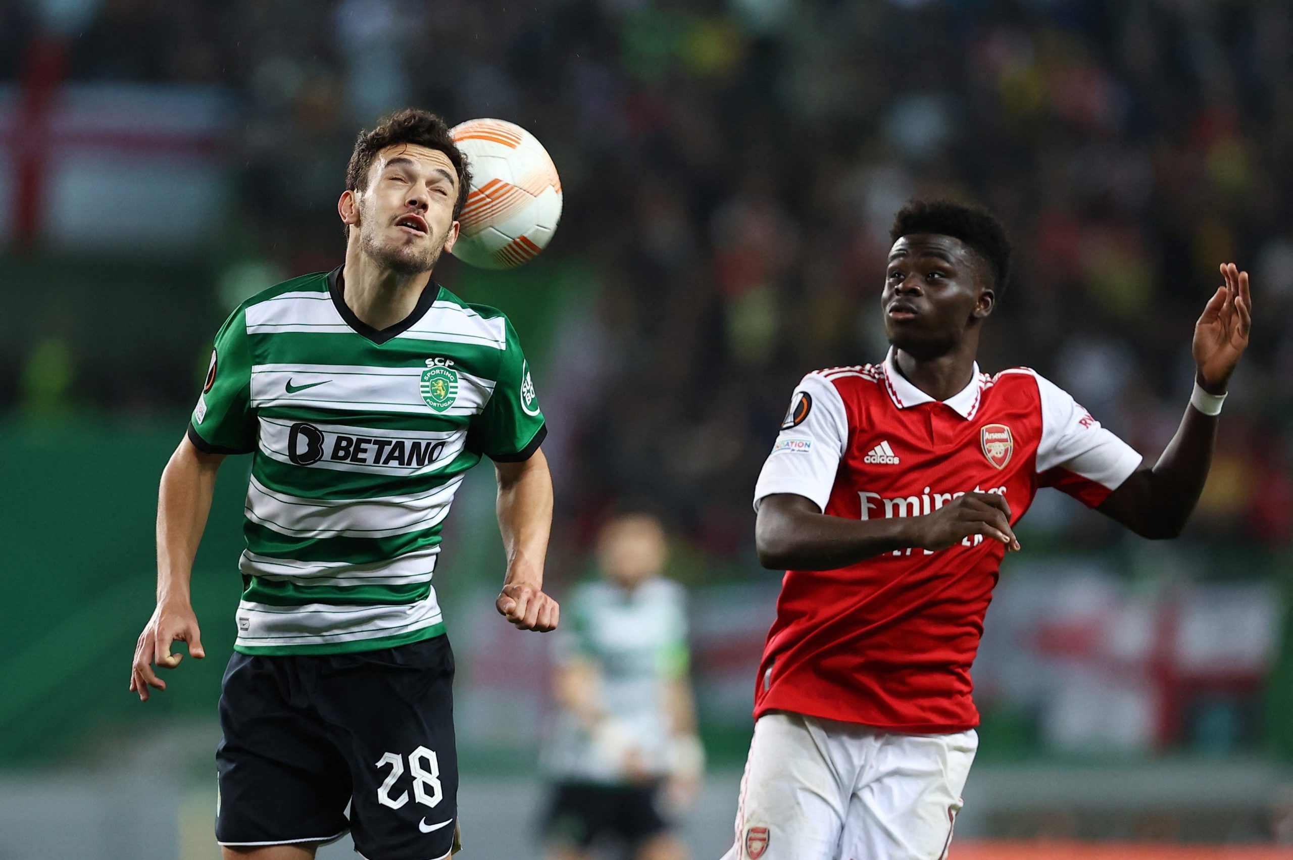 Soccer Football - Europa League - Round of 16 - First Leg - Sporting CP v Arsenal - Estadio Jose Alvalade, Lisbon, Portugal - March 9, 2023  Arsenal's Bukayo Saka in action with Sporting CP's Pedro Goncalves REUTERS/Rodrigo Antunes