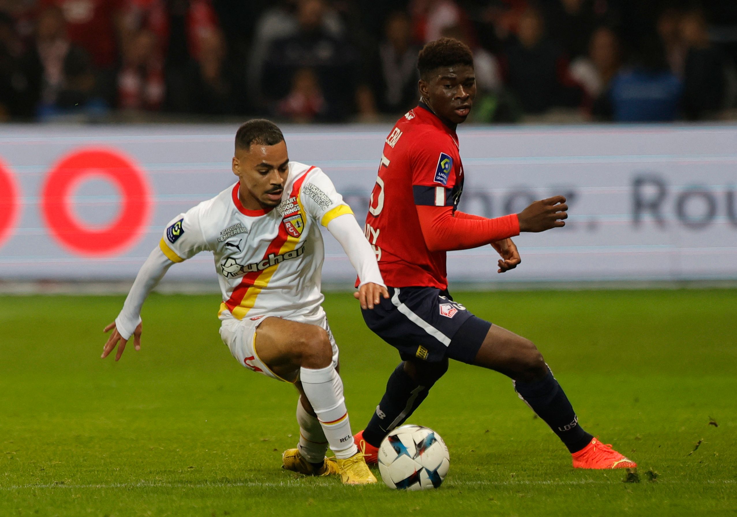 Soccer Football - Ligue 1 - Lille v RC Lens - Stade Pierre-Mauroy, Villeneuve-d'Ascq, France - October 9, 2022 Lille's Carlos Noom Quomah Baleba in action with RC Lens' Alexis Claude Maurice REUTERS/Pascal Rossignol