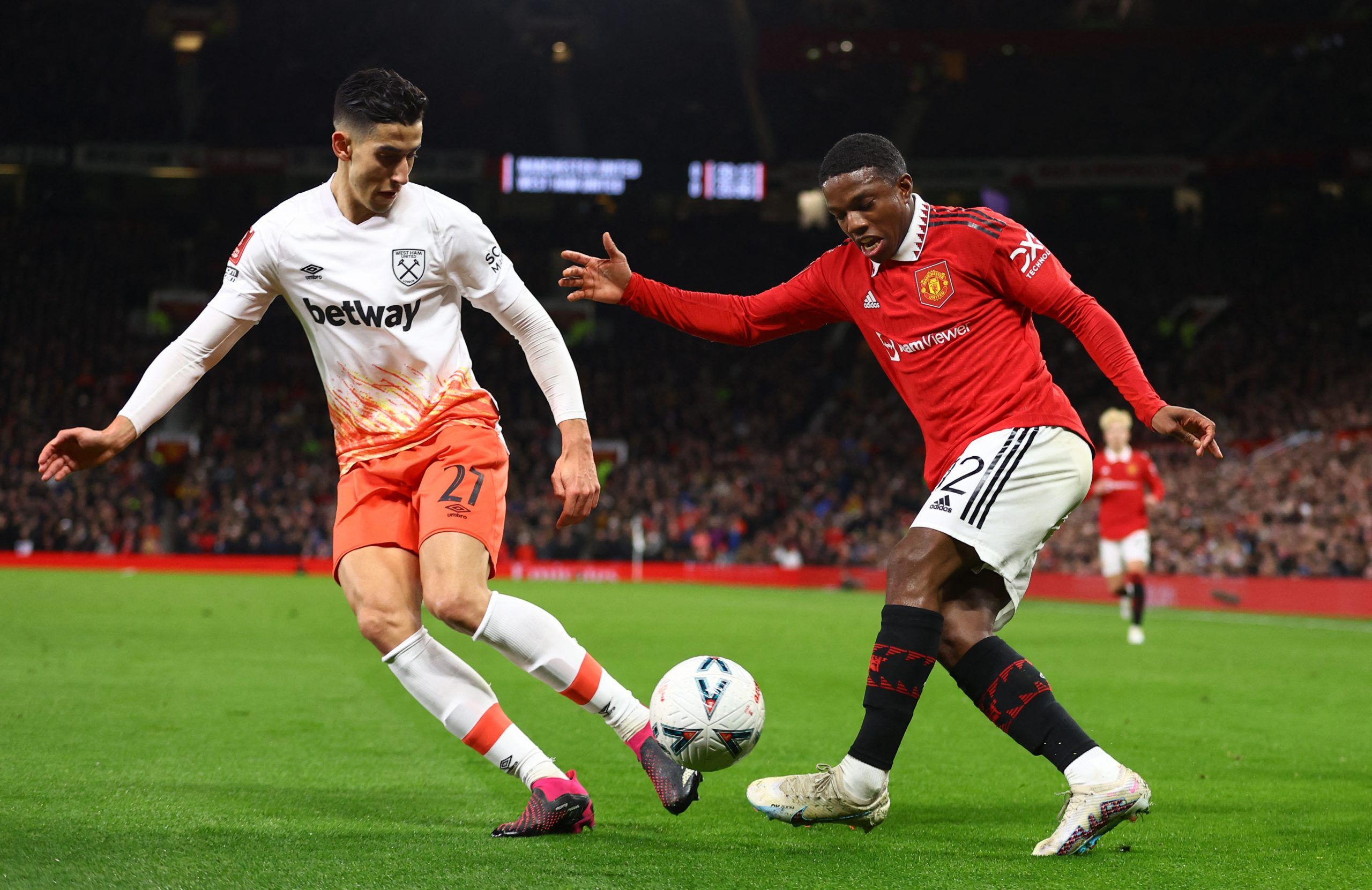 Soccer Football - FA Cup - Fifth Round - Manchester United v West Ham United - Old Trafford, Manchester, Britain - March 1, 2023 West Ham United's Nayef Aguerd in action with Manchester United's Tyrell Malacia REUTERS/Carl Recine