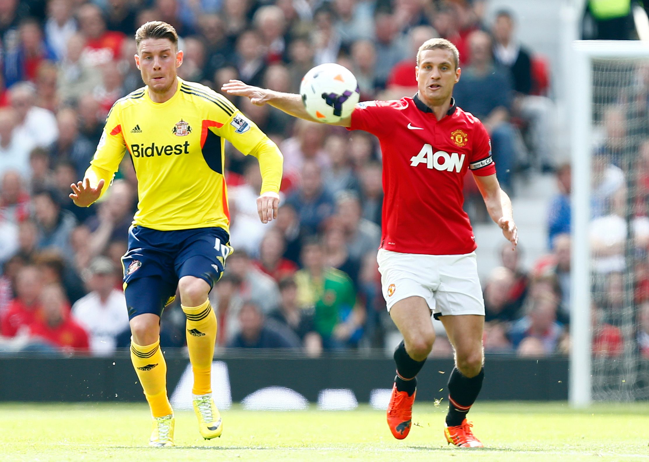 Football - Manchester United v Sunderland - Barclays Premier League - Old Trafford  - 3/5/14 
Manchester United's Nemanja Vidic (R) and Sunderland's Connor Wickham in action 
Mandatory Credit: Action Images / Jason Cairnduff 
Livepic 
EDITORIAL USE ONLY. No use with unauthorized audio, video, data, fixture lists, club/league logos or 