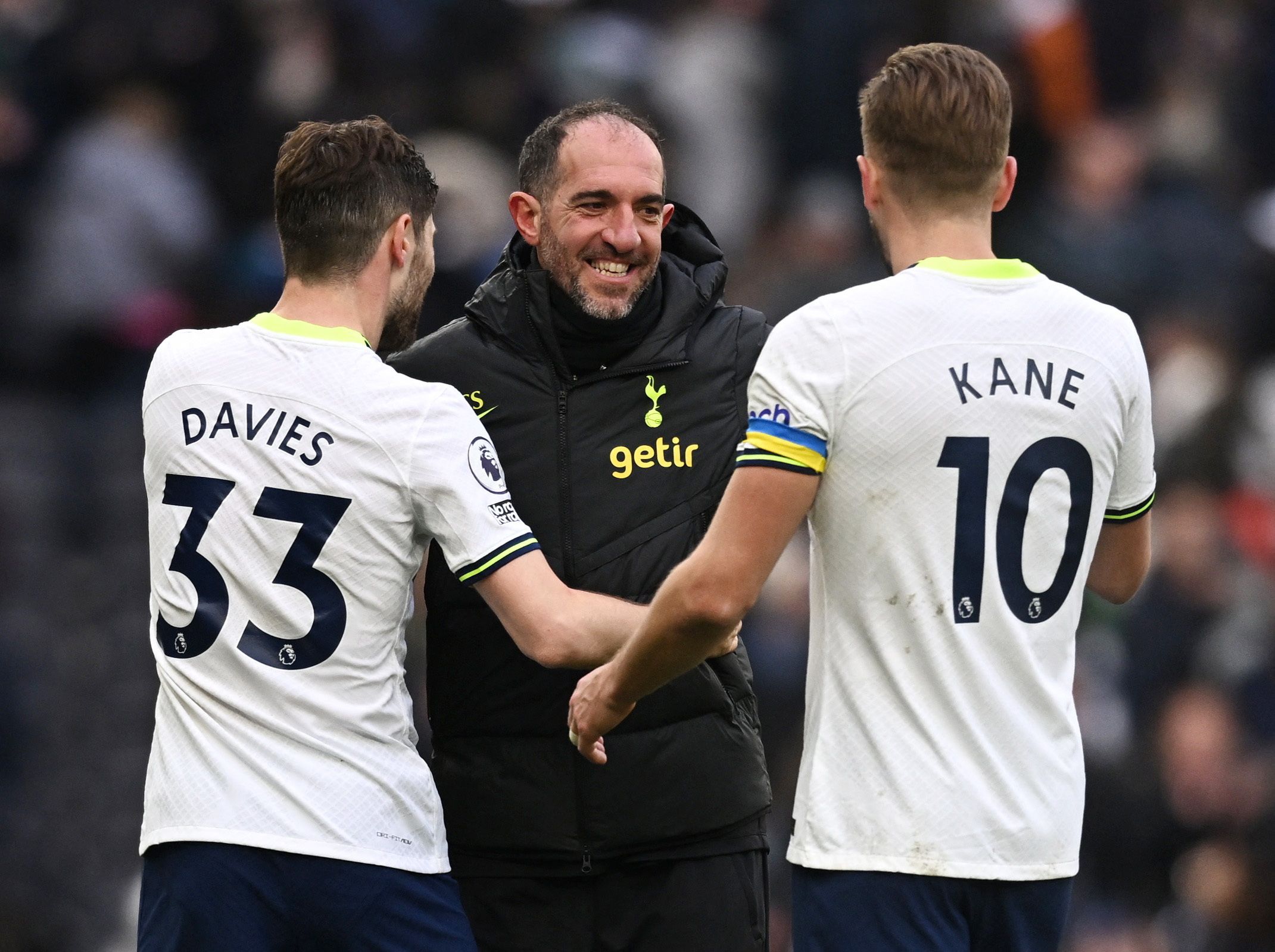 Tottenham Hotspur assistant manager Cristian Stellini, Ben Davies and Harry Kane celebrate after the match