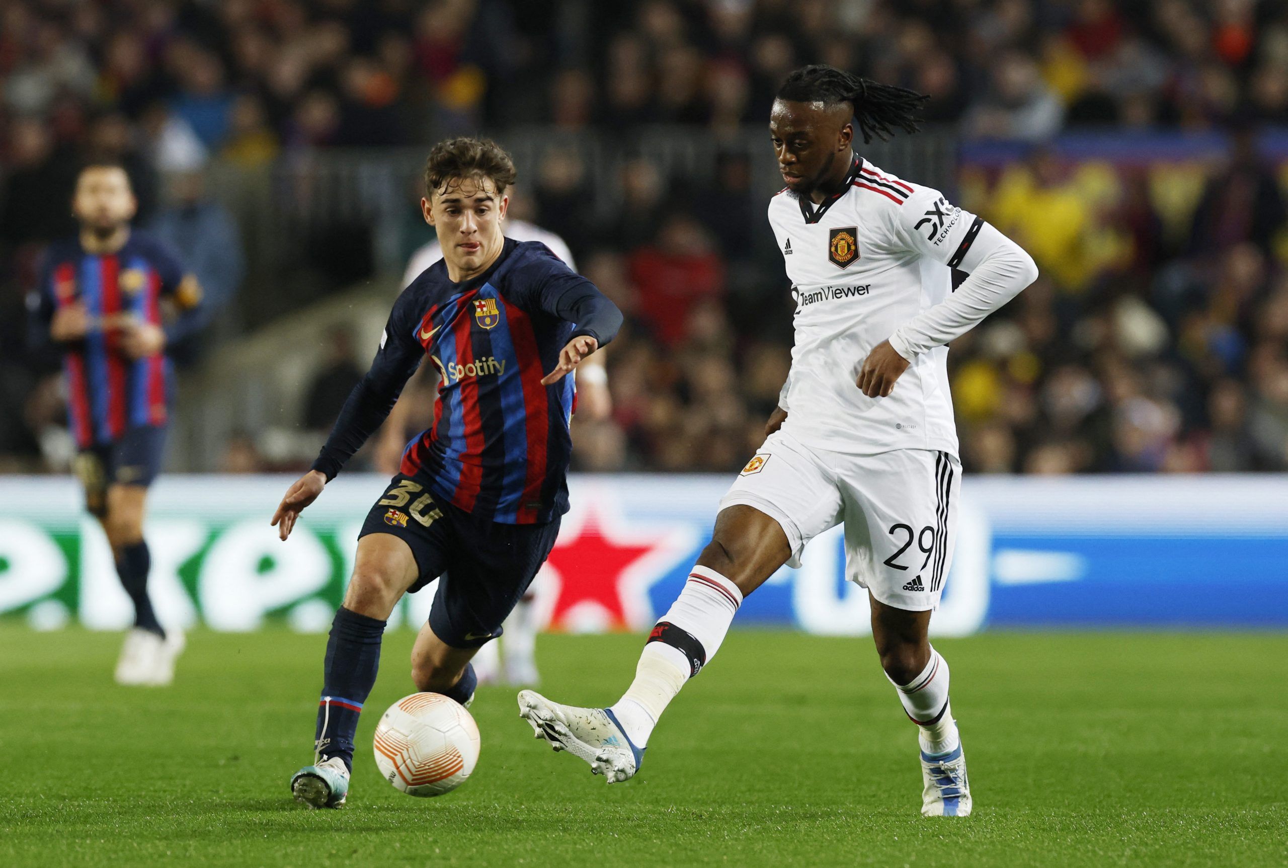 Soccer Football - Europa League - Play-Off First Leg - FC Barcelona v Manchester United - Camp Nou, Barcelona, Spain - February 16, 2023  FC Barcelona's Gavi in action with Manchester United's Aaron Wan-Bissaka REUTERS/Albert Gea