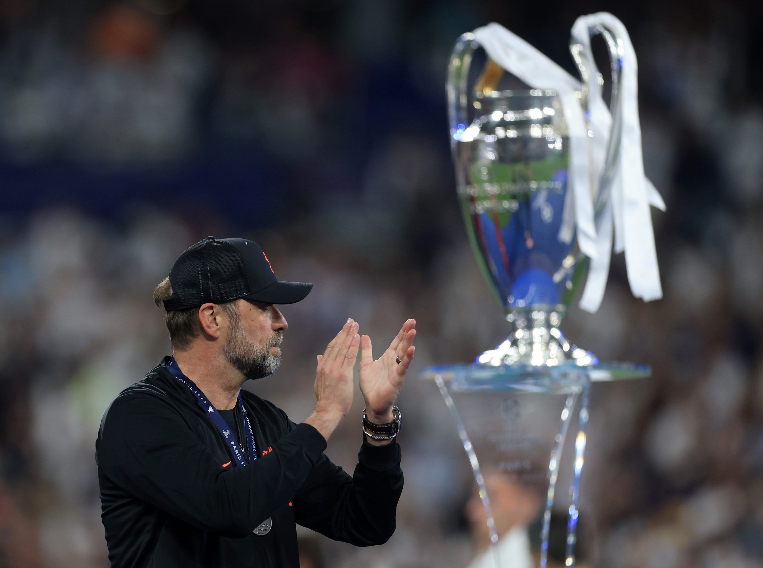 Soccer Football - Champions League Final - Liverpool v Real Madrid - Stade de France, Saint-Denis near Paris, France - May 28, 2022 Liverpool manager Juergen Klopp acknowledges fans as he walks pas the trophy and collects his runners up medal after the match REUTERS/Lee Smith