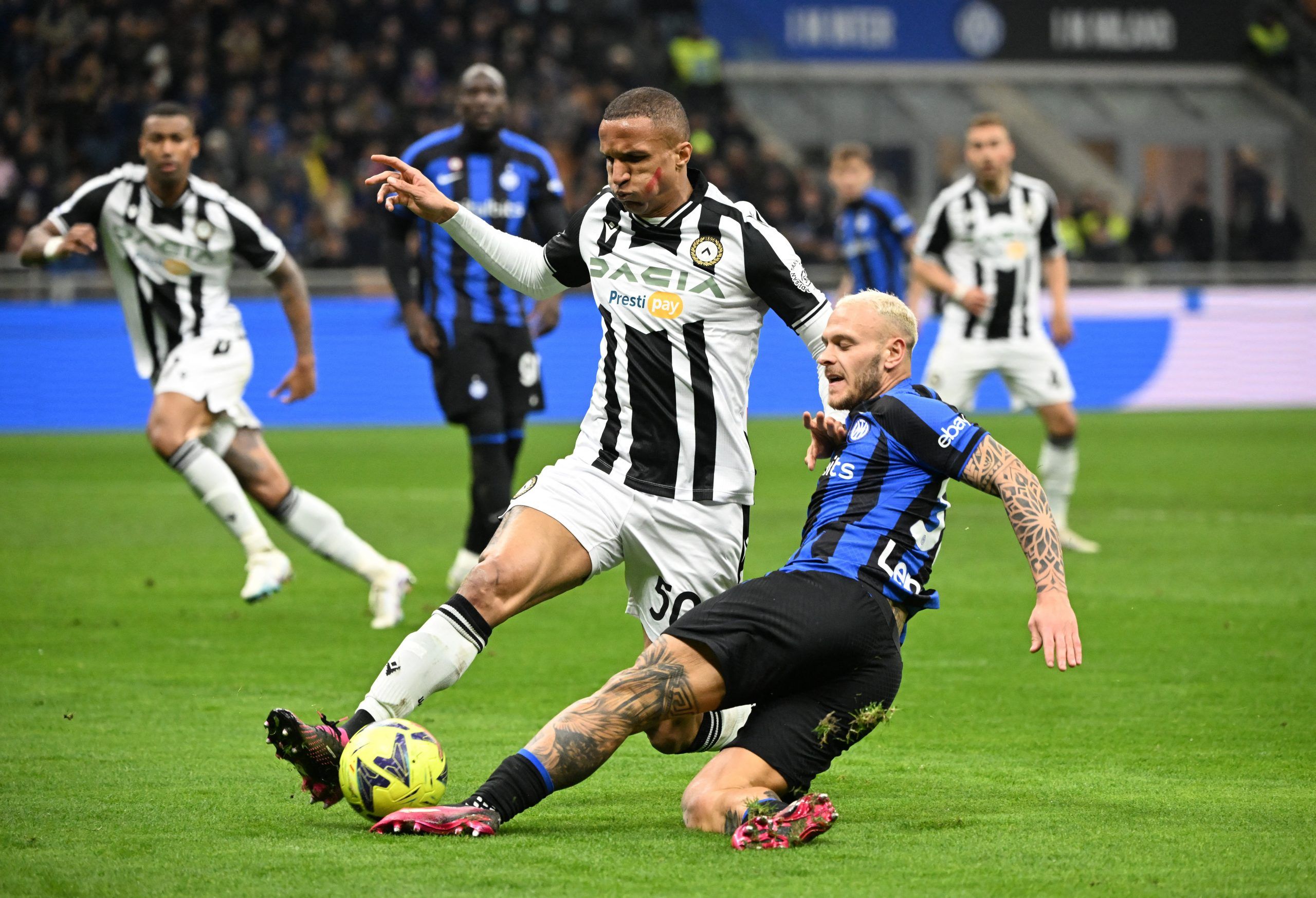 Soccer Football - Serie A - Inter Milan v Udinese - San Siro, Milan, Italy - February 18, 2023 Udinese's Rodrigo Becao in action with Inter Milan's Federico Dimarco REUTERS/Alberto Lingria