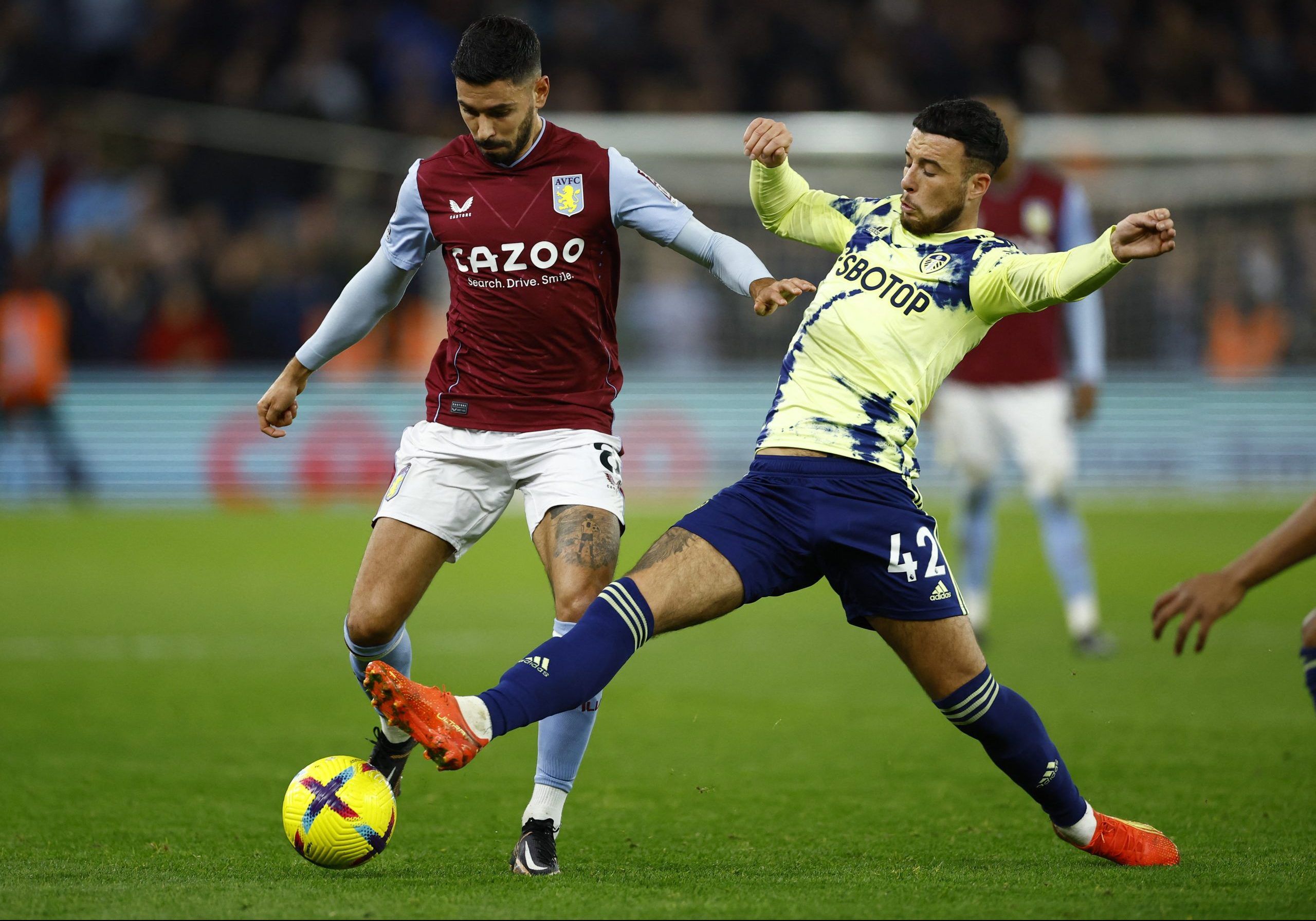 Soccer Football - Premier League - Aston Villa v Leeds United - Villa Park, Birmingham, Britain - January 13, 2023 Aston Villa's Morgan Sanson in action with Leeds United's Sam Greenwood Action Images via Reuters/Andrew Boyers EDITORIAL USE ONLY. No use with unauthorized audio, video, data, fixture lists, club/league logos or 'live' services. Online in-match use limited to 75 images, no video emulation. No use in betting, games or single club /league/player publications.  Please contact your acc