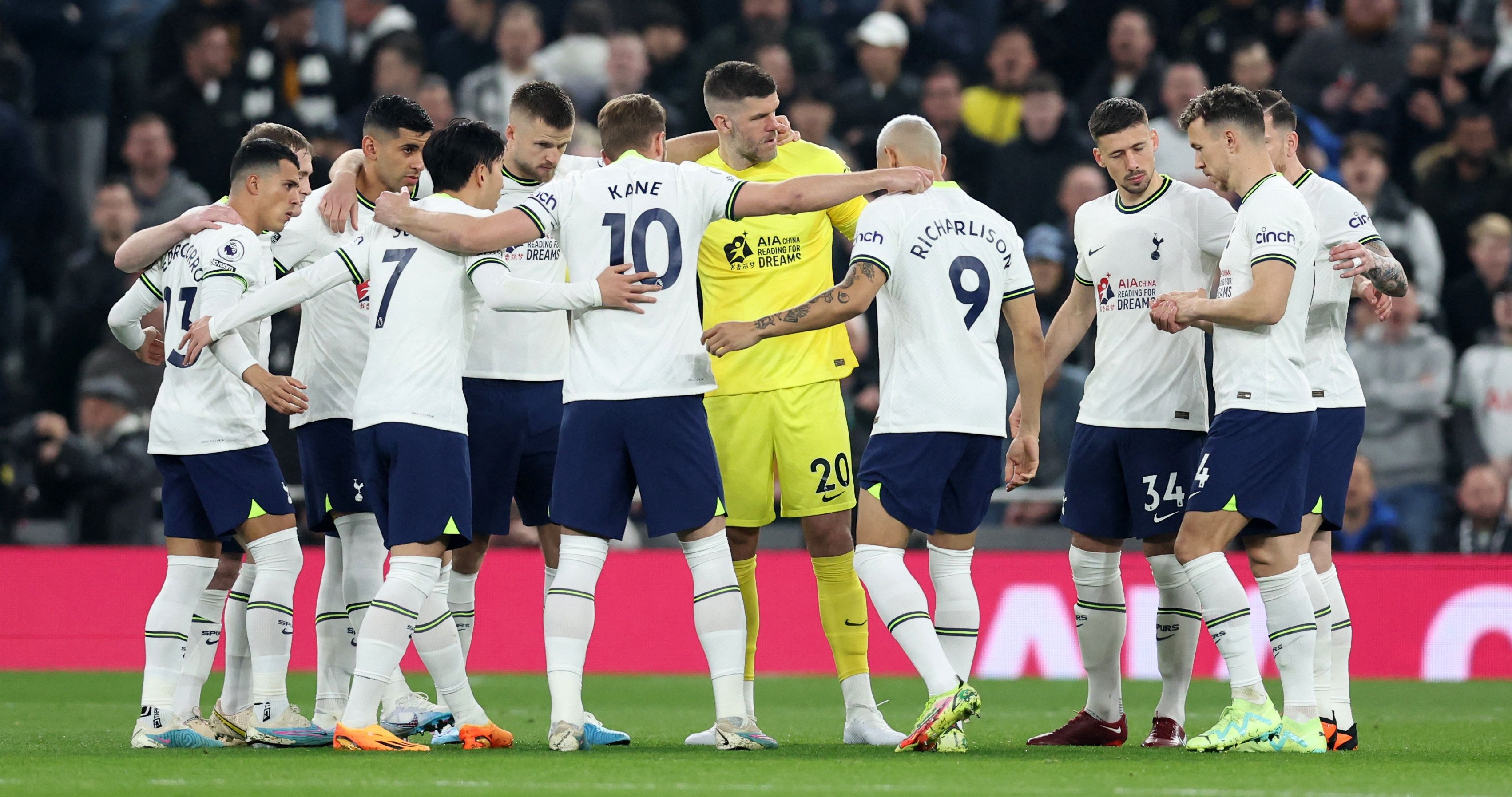Tottenham Hotspur players huddle before the match