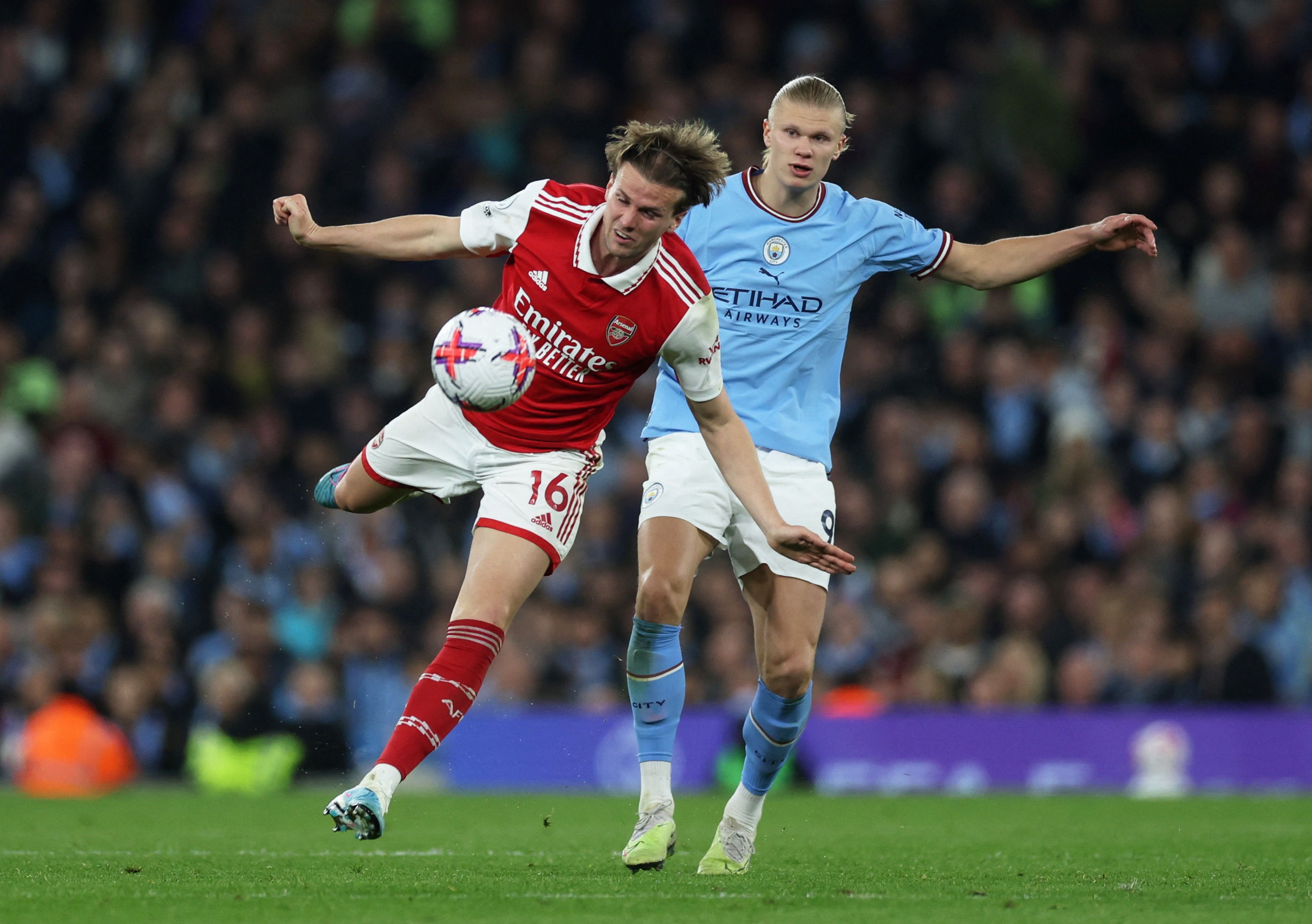 Arsenal's Rob Holding in action with Manchester City's Erling Braut Haaland