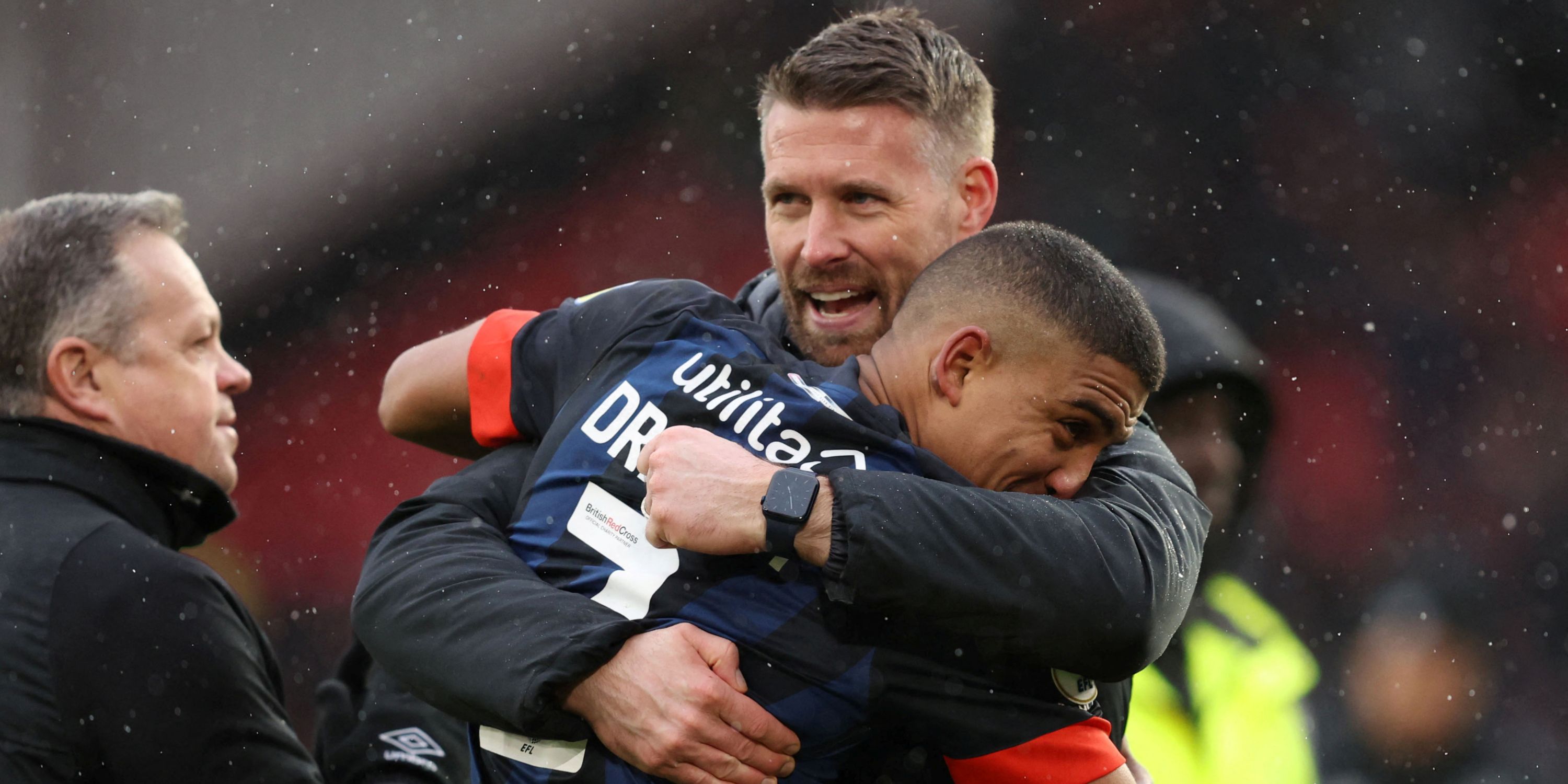 Cody Drameh embraces Luton Town manager Rob Edwards