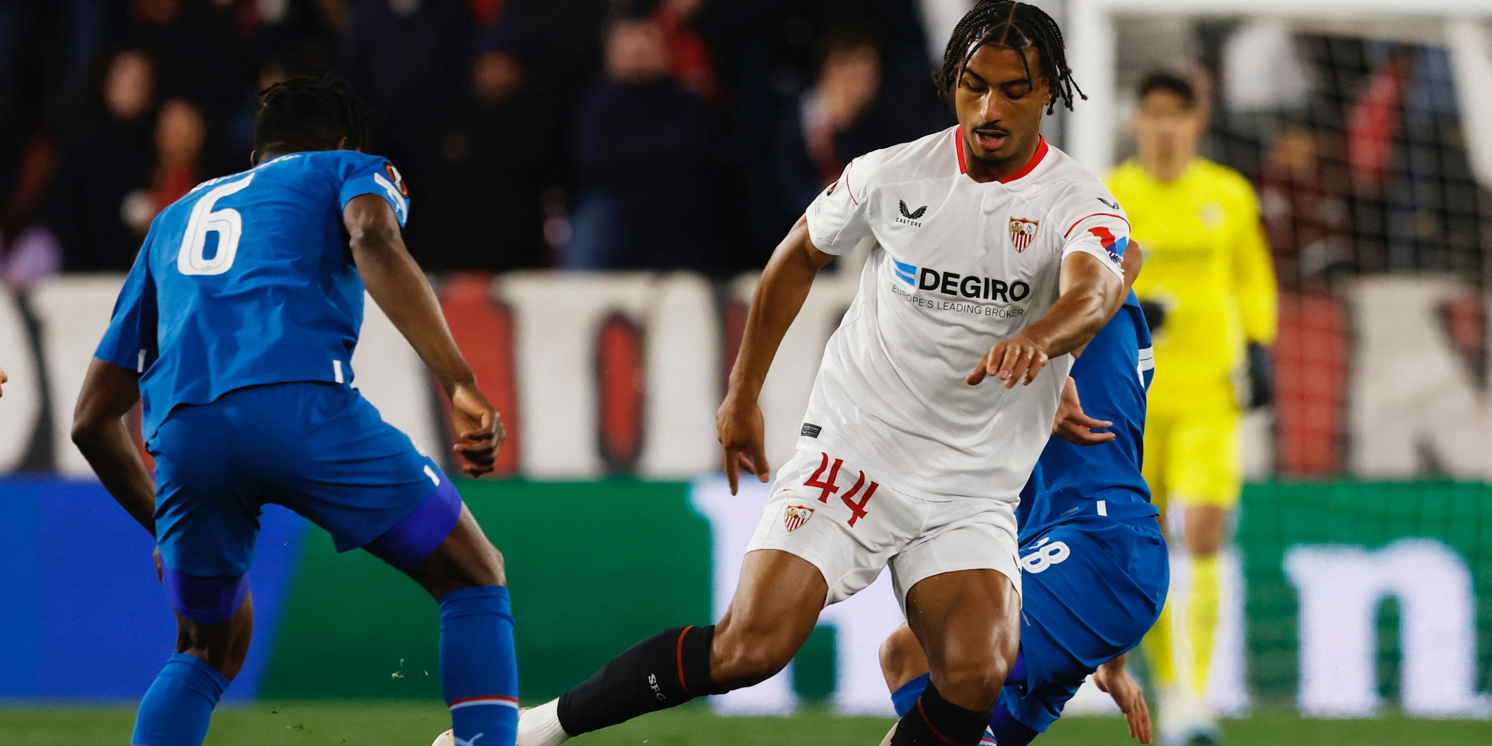 PSV Eindhoven's Ibrahim Sangare and Ismael Saibari in action with Sevilla's Loic Bade
