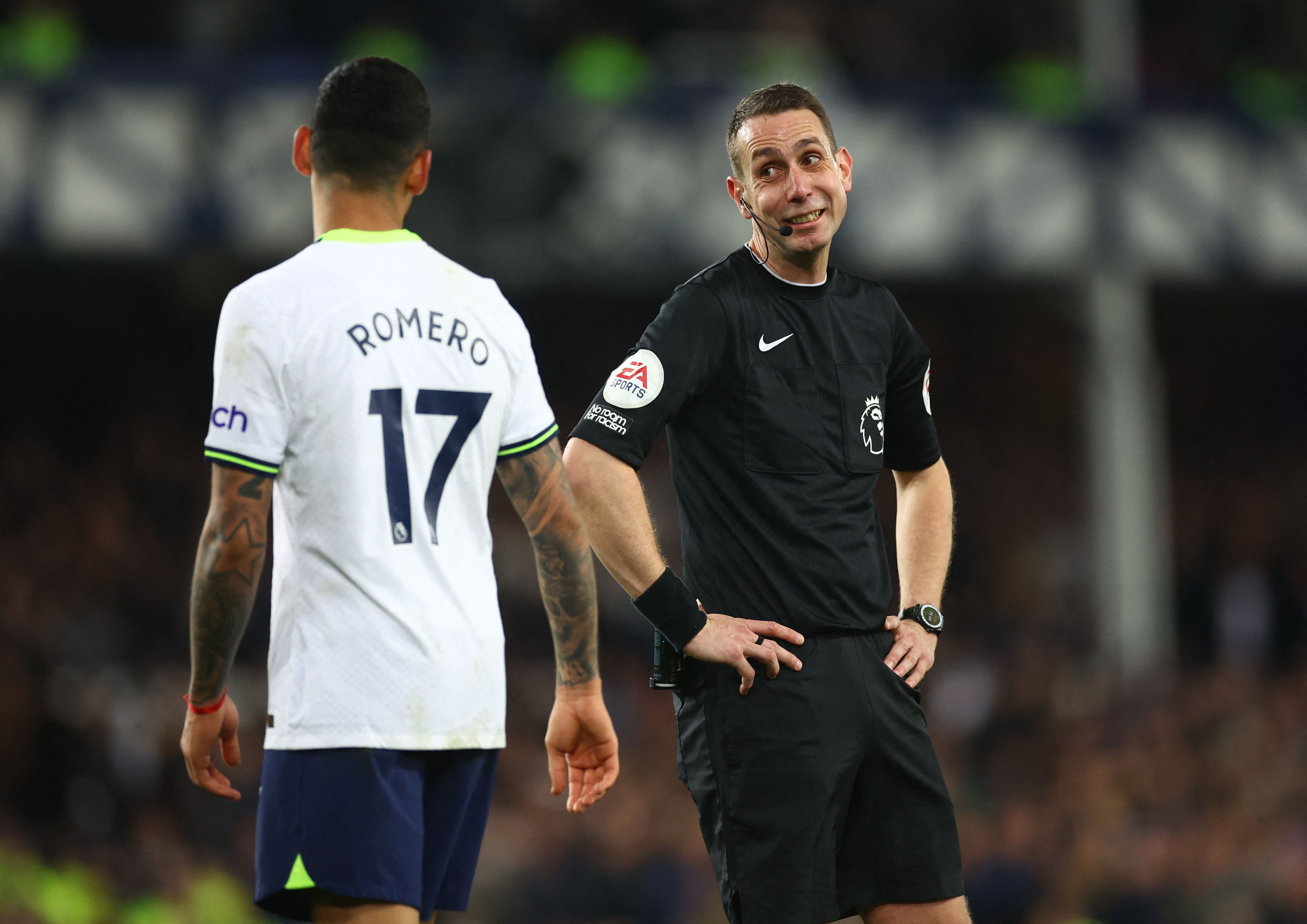 Tottenham Hotspur's Cristian Romero speaks to referee David Coote
